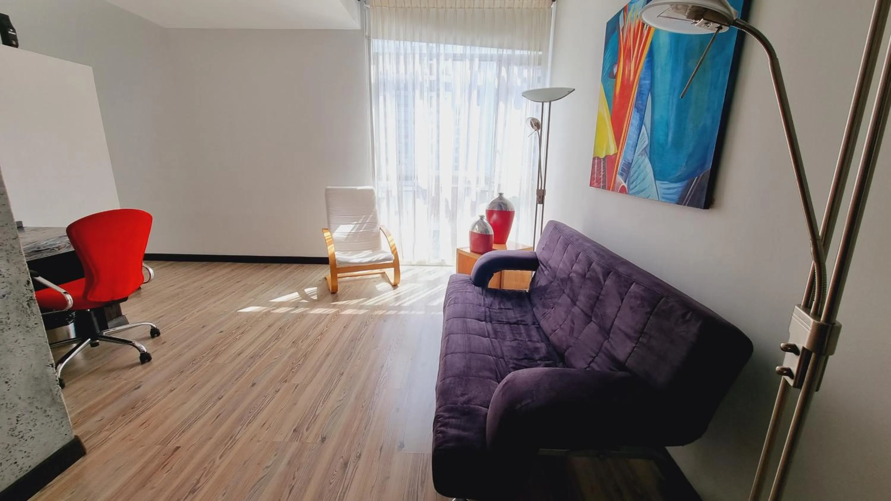 Living room in Habitat Suites Hotel By GHO Hoteles