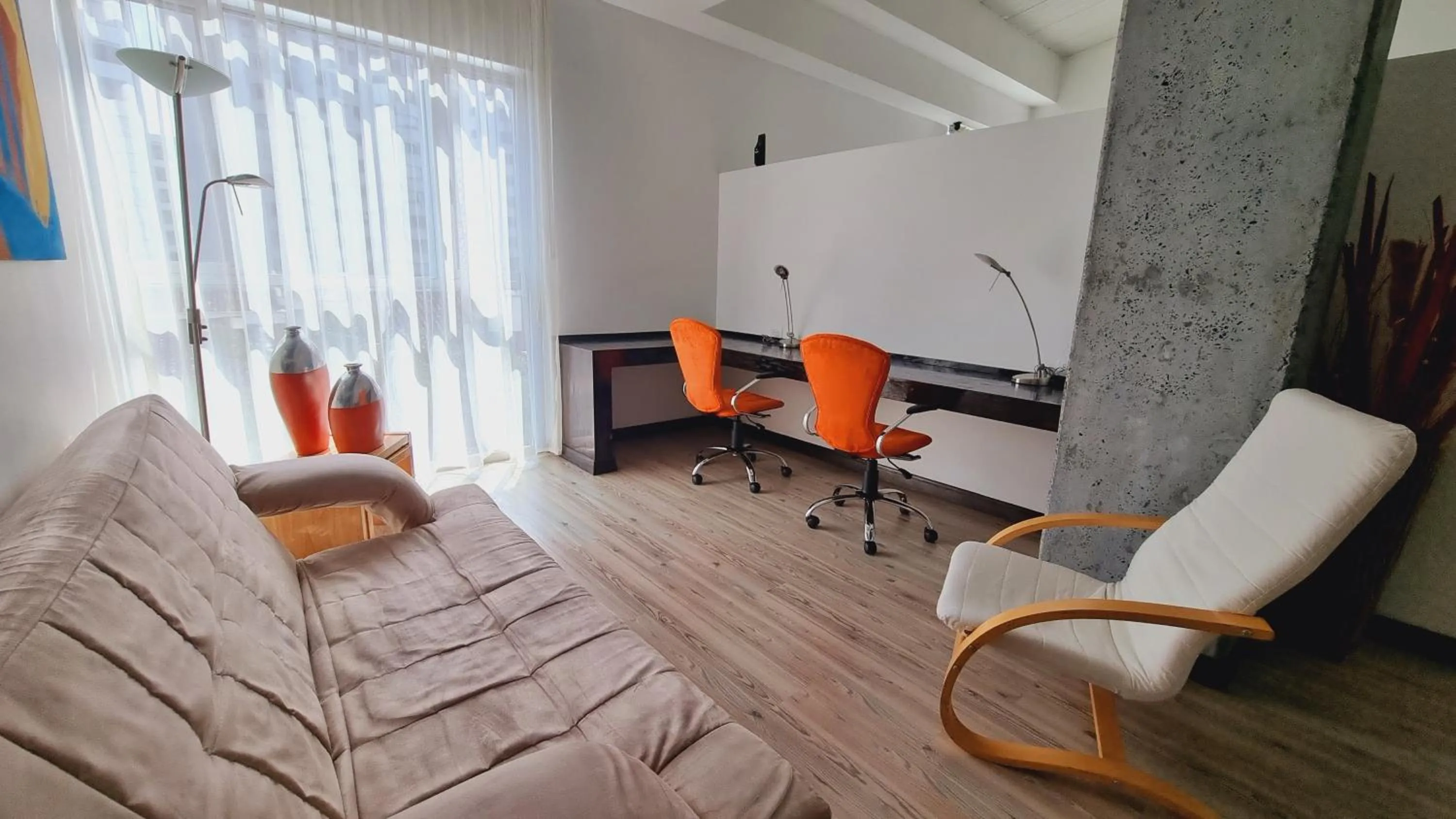 Living room in Habitat Suites Hotel By GHO Hoteles