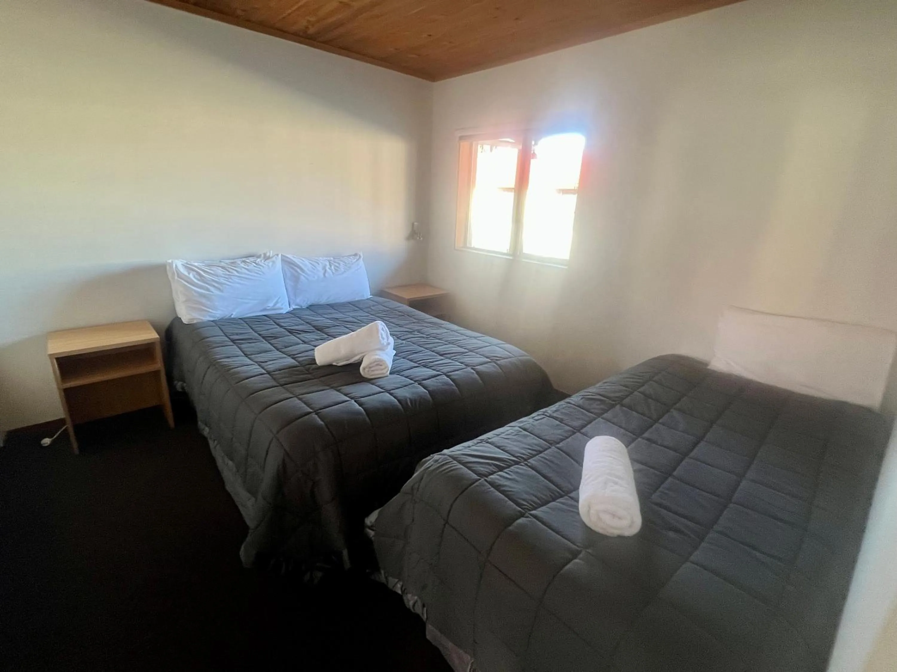 Bed in Pinewood Motels