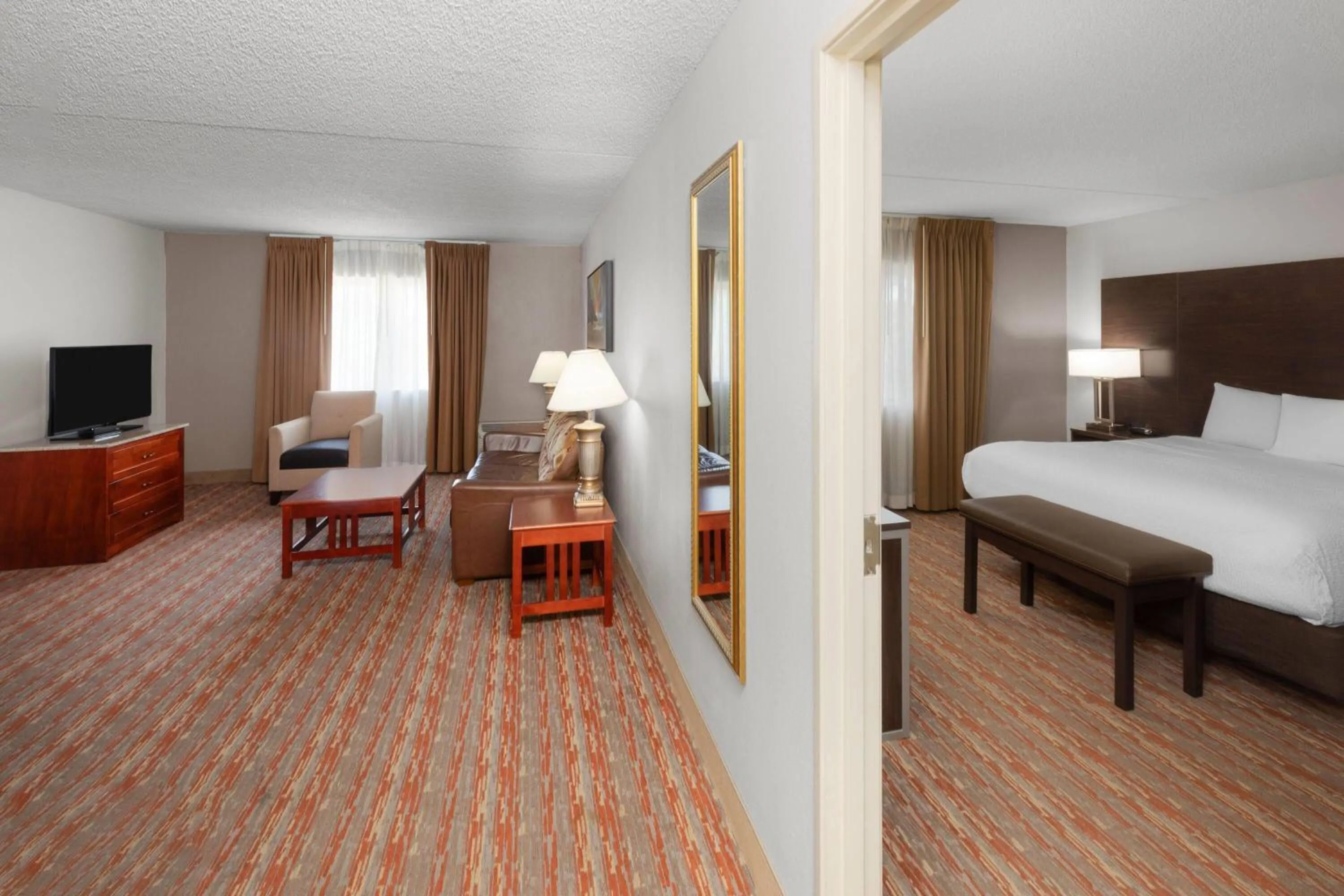 Photo of the whole room, Bed in Endeavor Inn & Suites, Trademark Collection by Wyndham