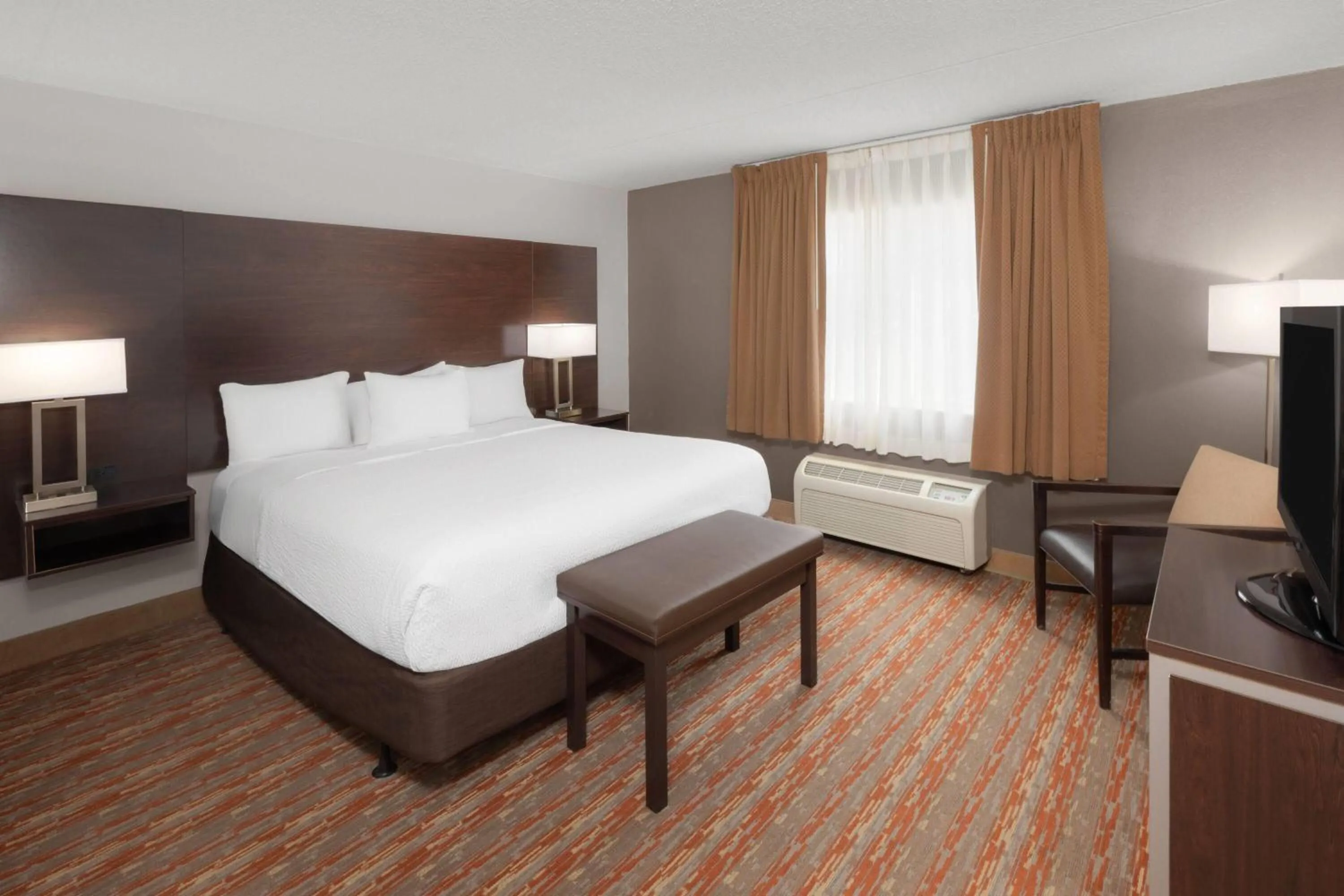 Photo of the whole room, Bed in Endeavor Inn & Suites, Trademark Collection by Wyndham