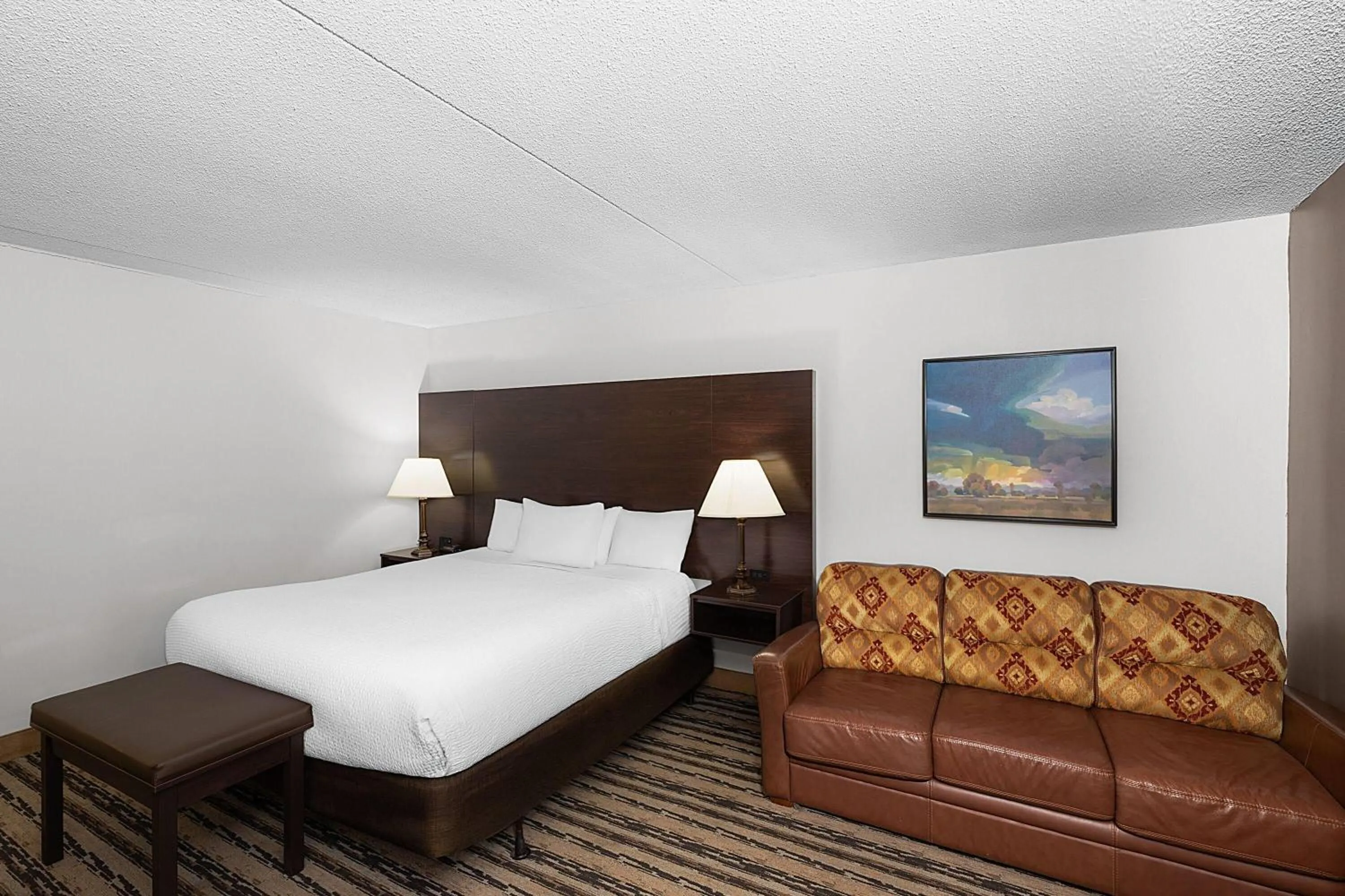 Photo of the whole room, Bed in Endeavor Inn & Suites, Trademark Collection by Wyndham