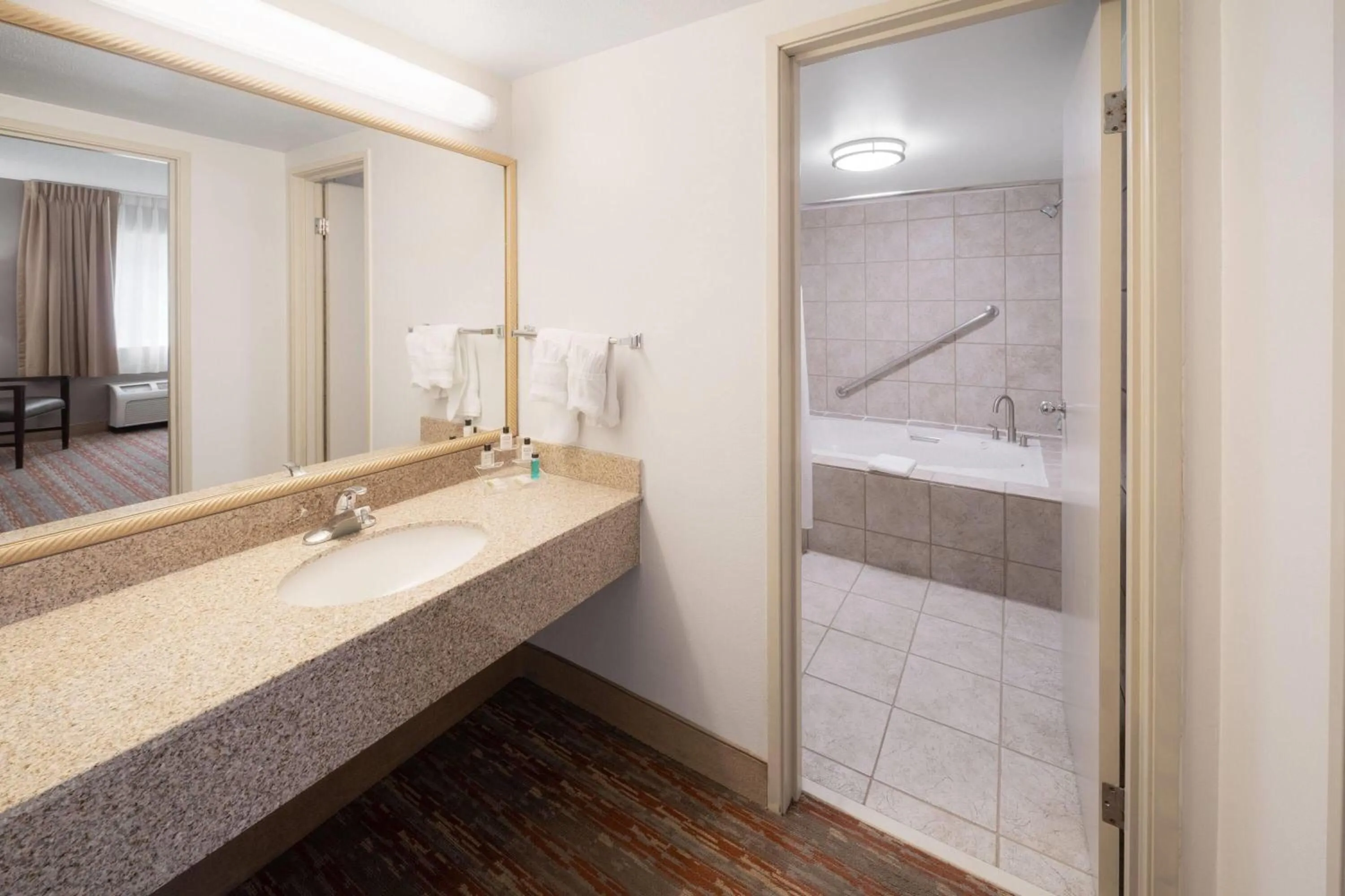 Photo of the whole room in Endeavor Inn & Suites, Trademark Collection by Wyndham