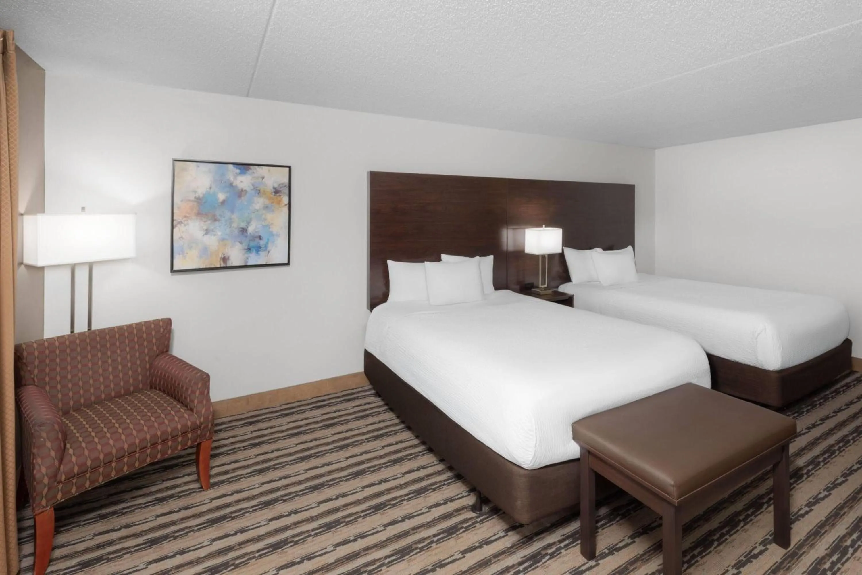 Photo of the whole room, Bed in Endeavor Inn & Suites, Trademark Collection by Wyndham