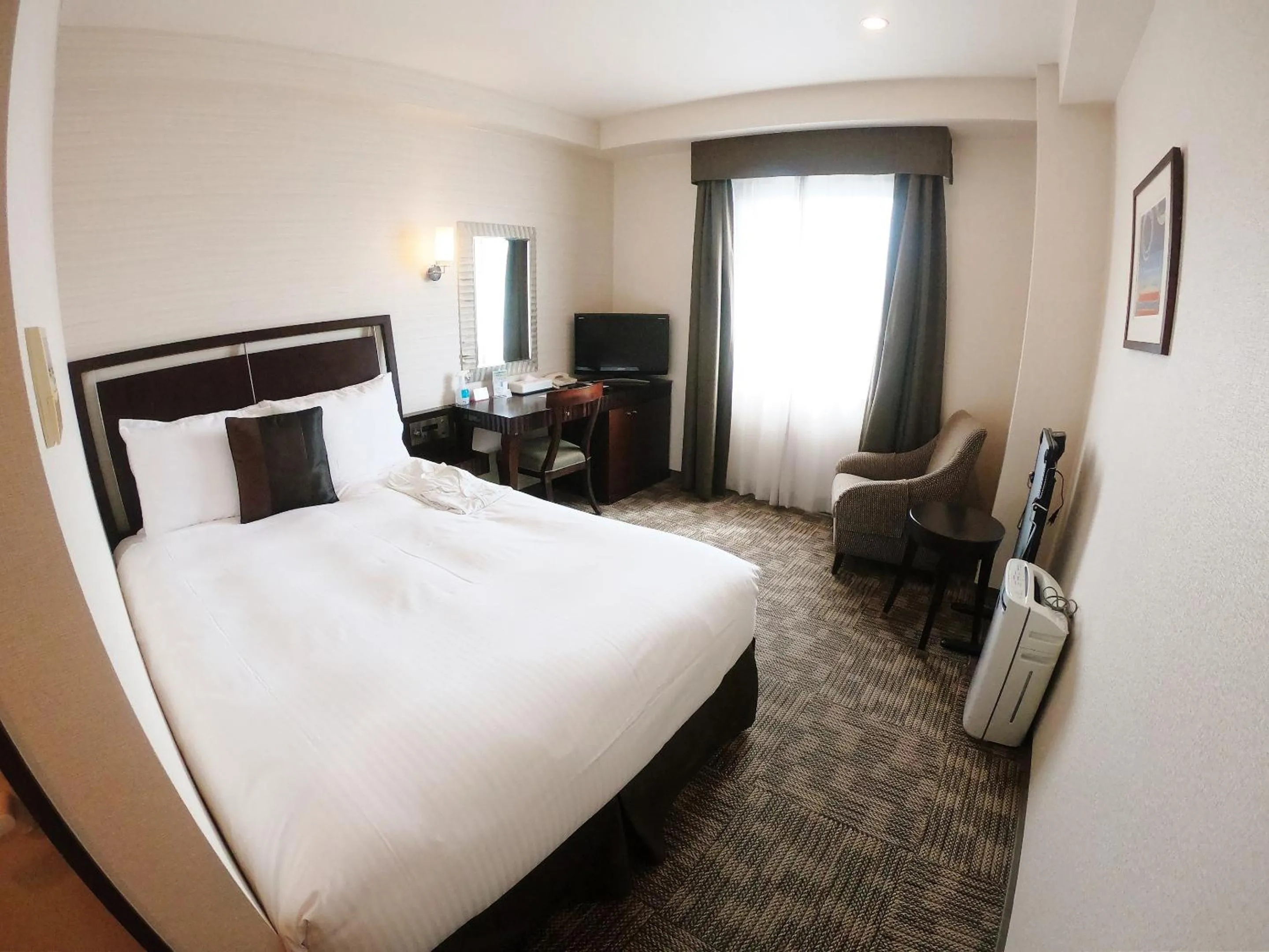 Photo of the whole room, Bed in Sol Vita Hotel Naha