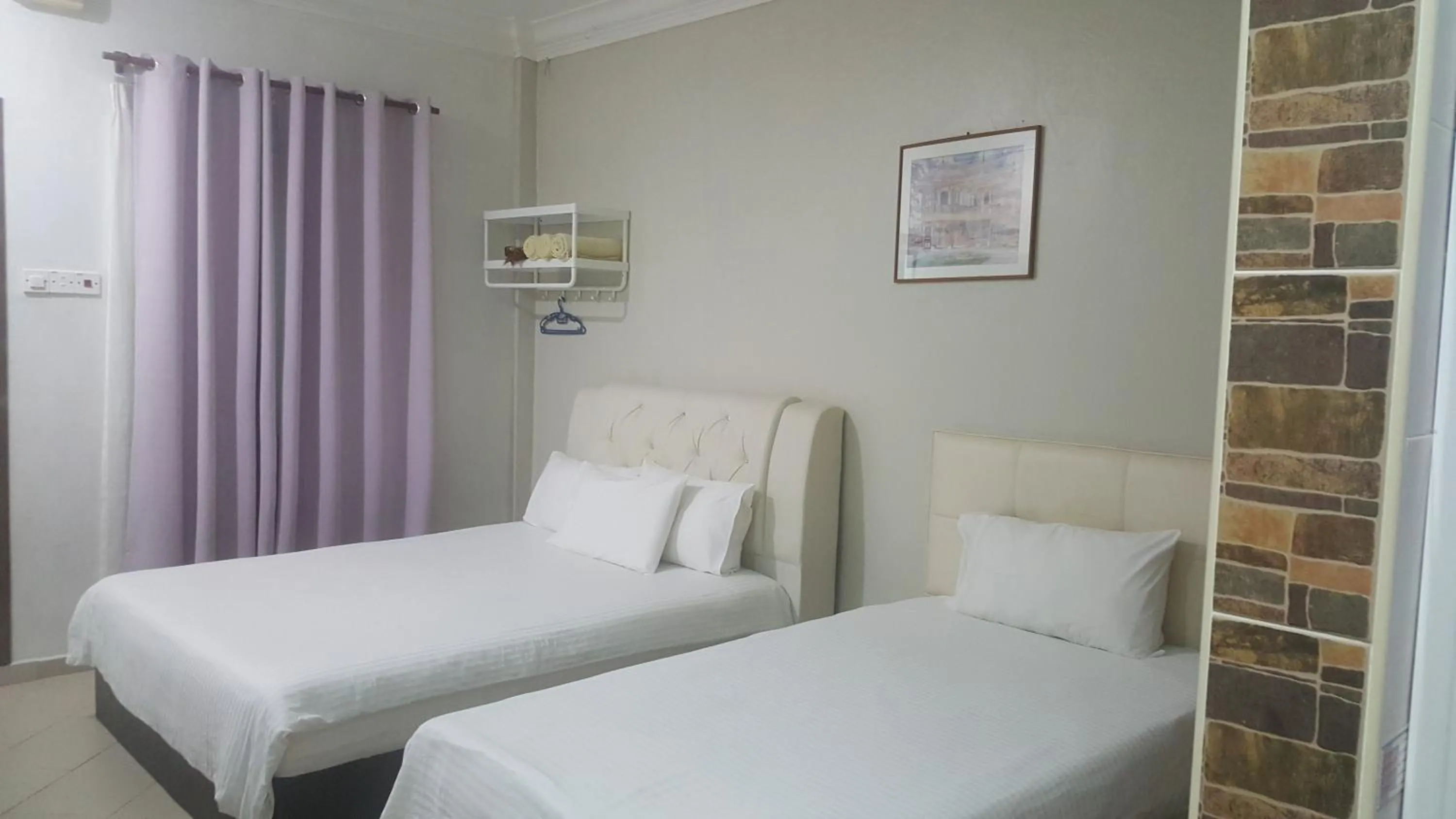 Bed in HOTEL SHAFURA 1