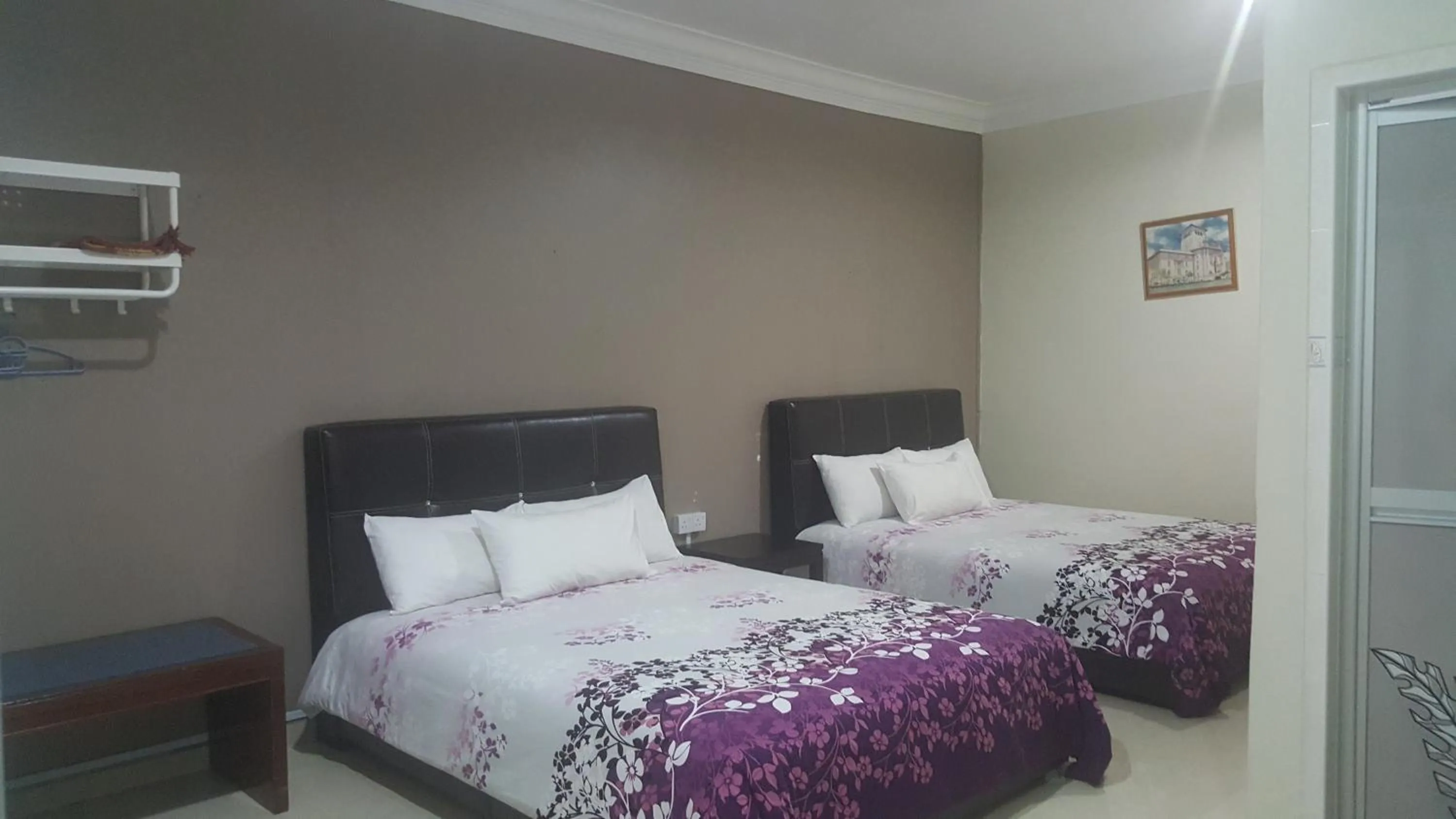 Bed in HOTEL SHAFURA 1