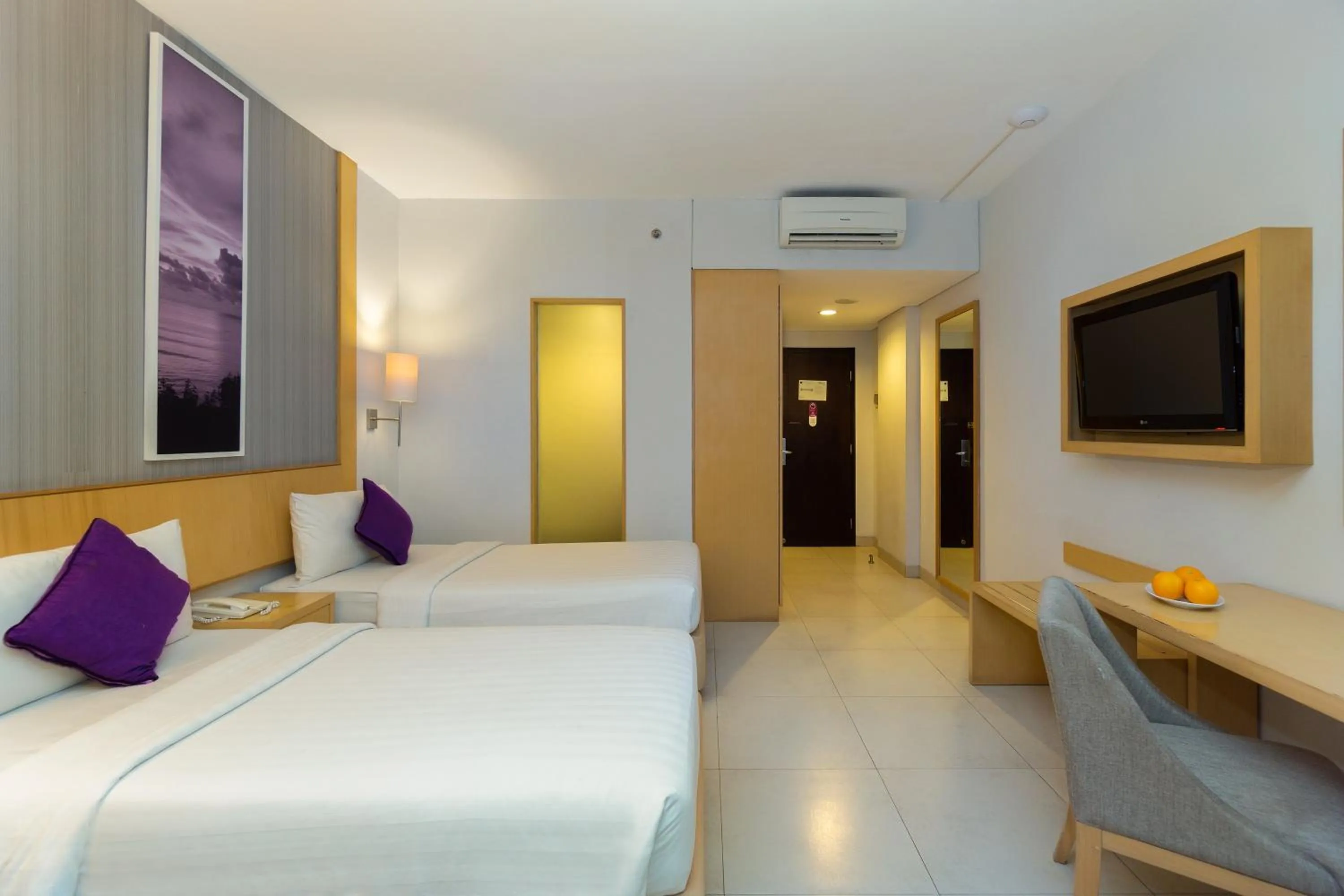 Bed in Quest Hotel Kuta by ASTON