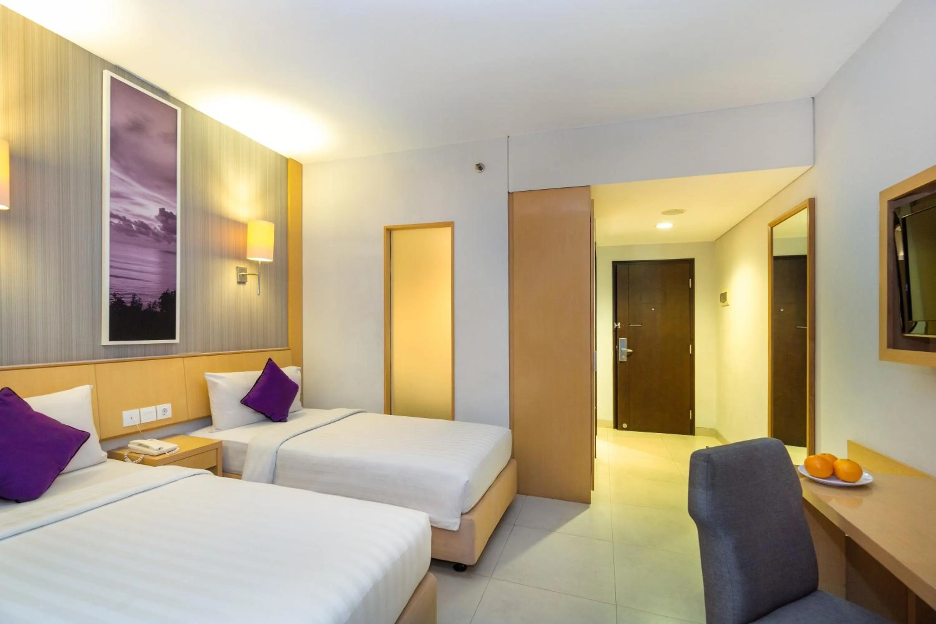 Bed in Quest Hotel Kuta by ASTON