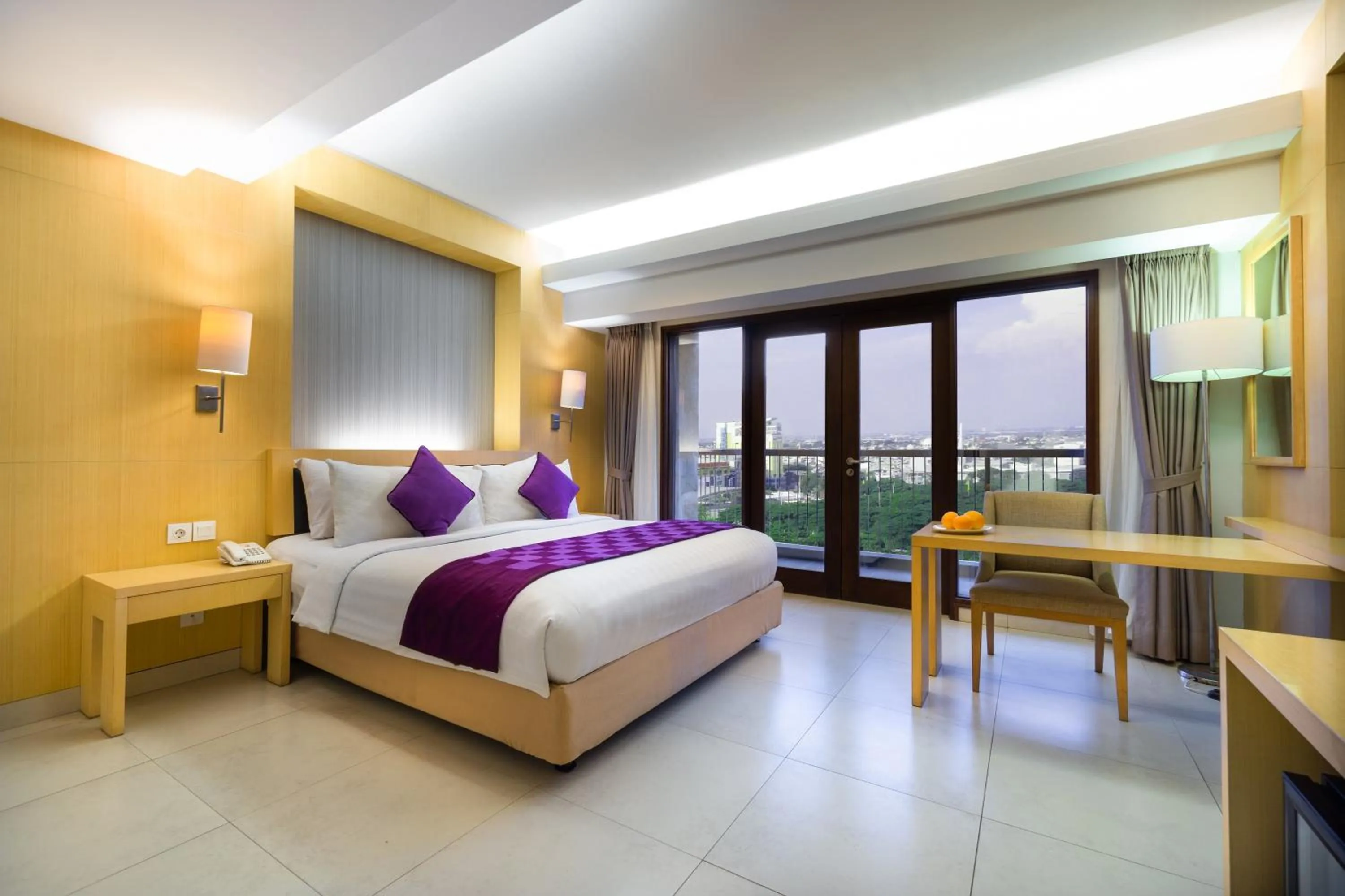 Bed in Quest Hotel Kuta by ASTON