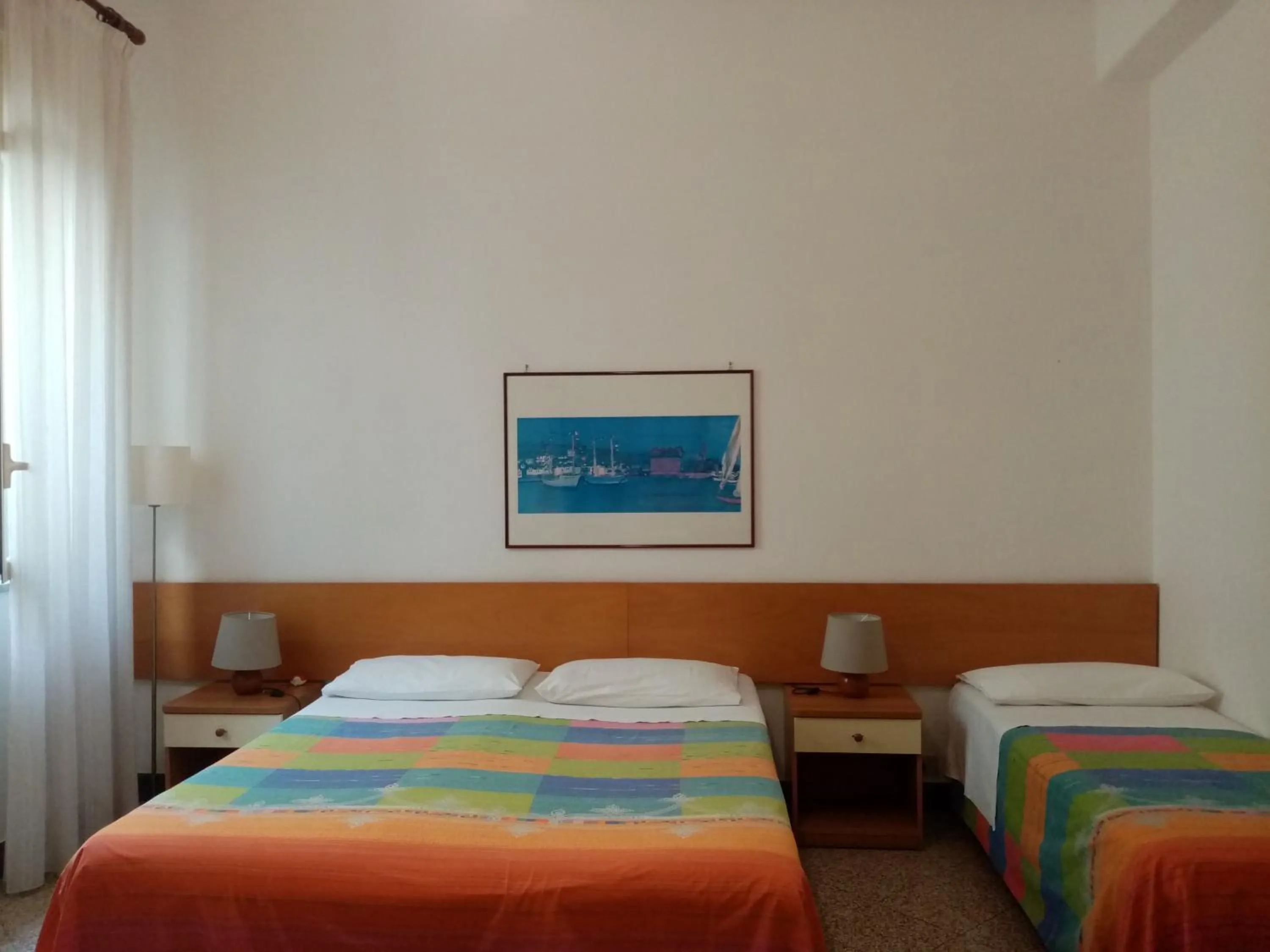 Bed in Ariston Petit Hotel