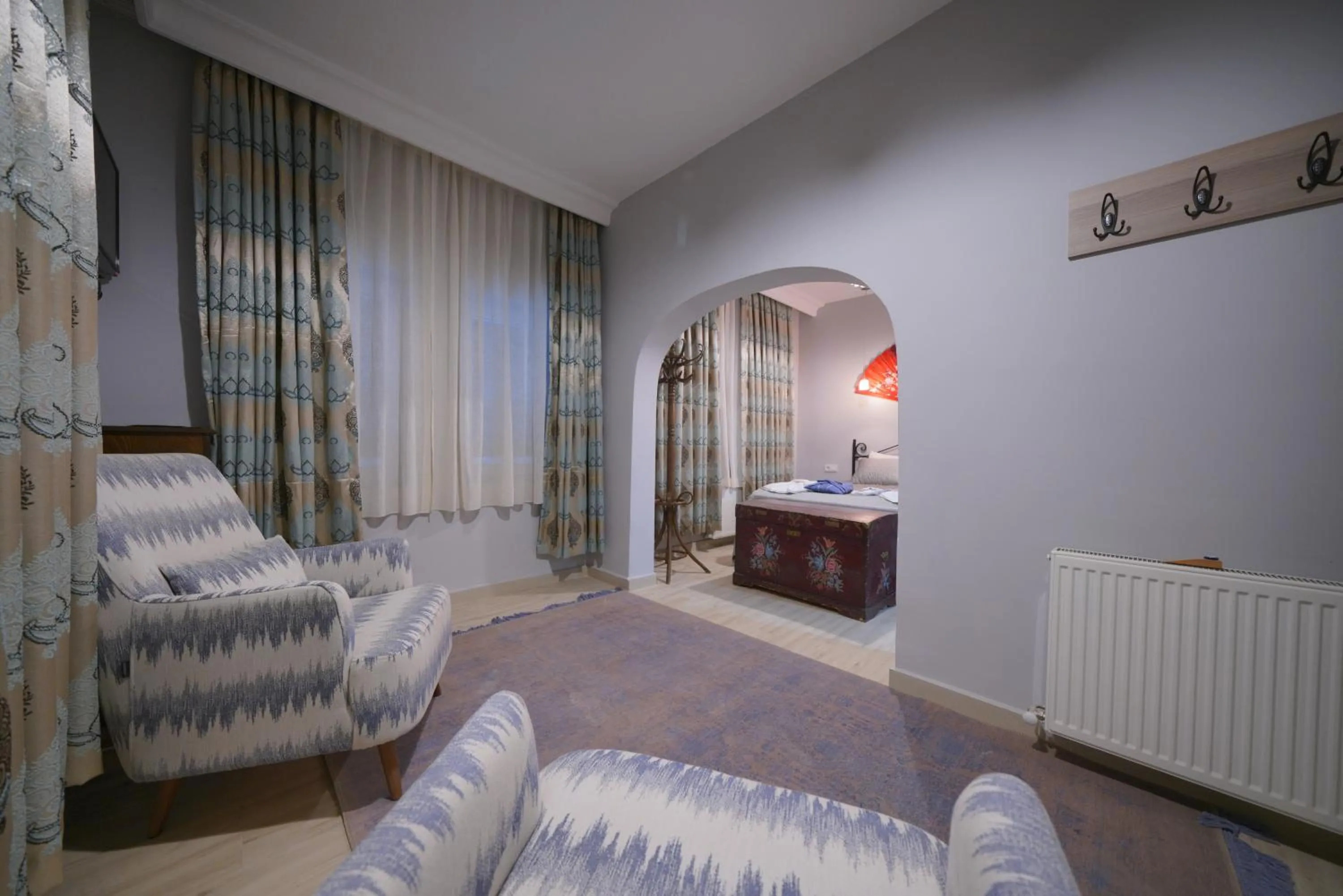 Communal lounge/ TV room in Pashabelle Hotel