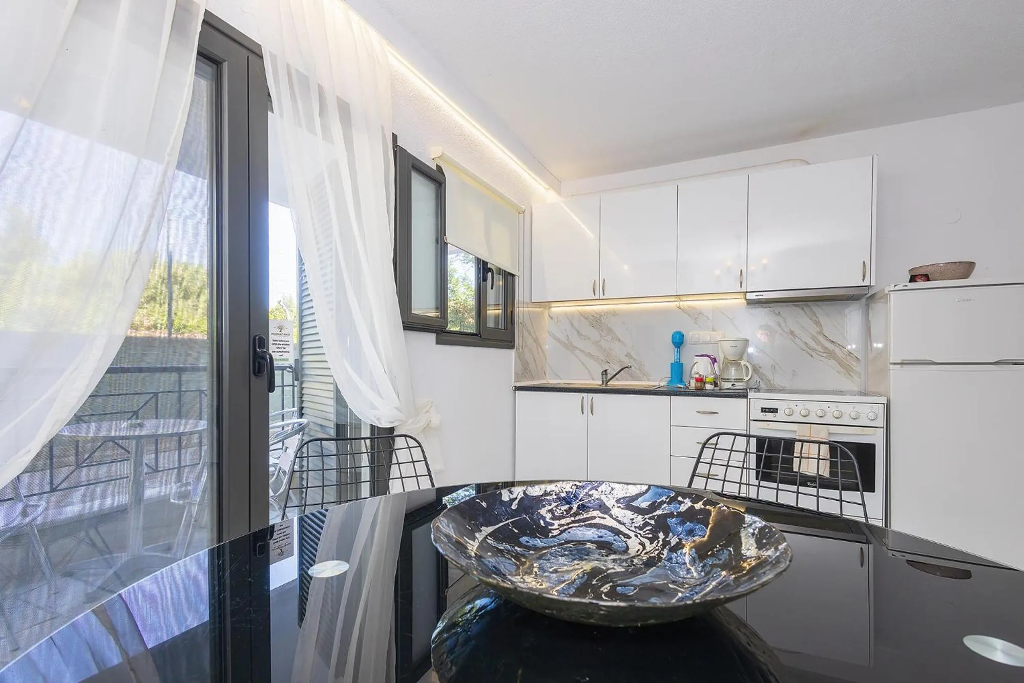 kitchen in Salonikiou Beach Apartments & Villas