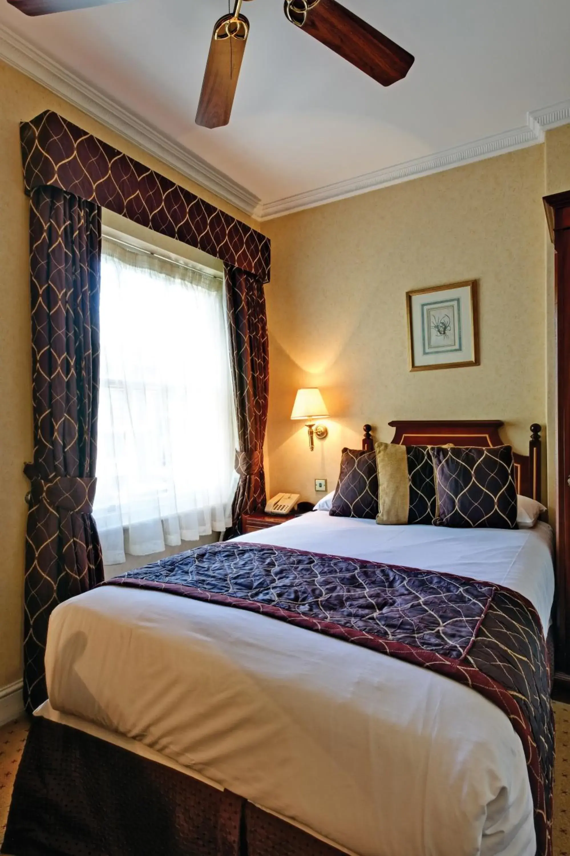 Bed in Grange Blooms Hotel