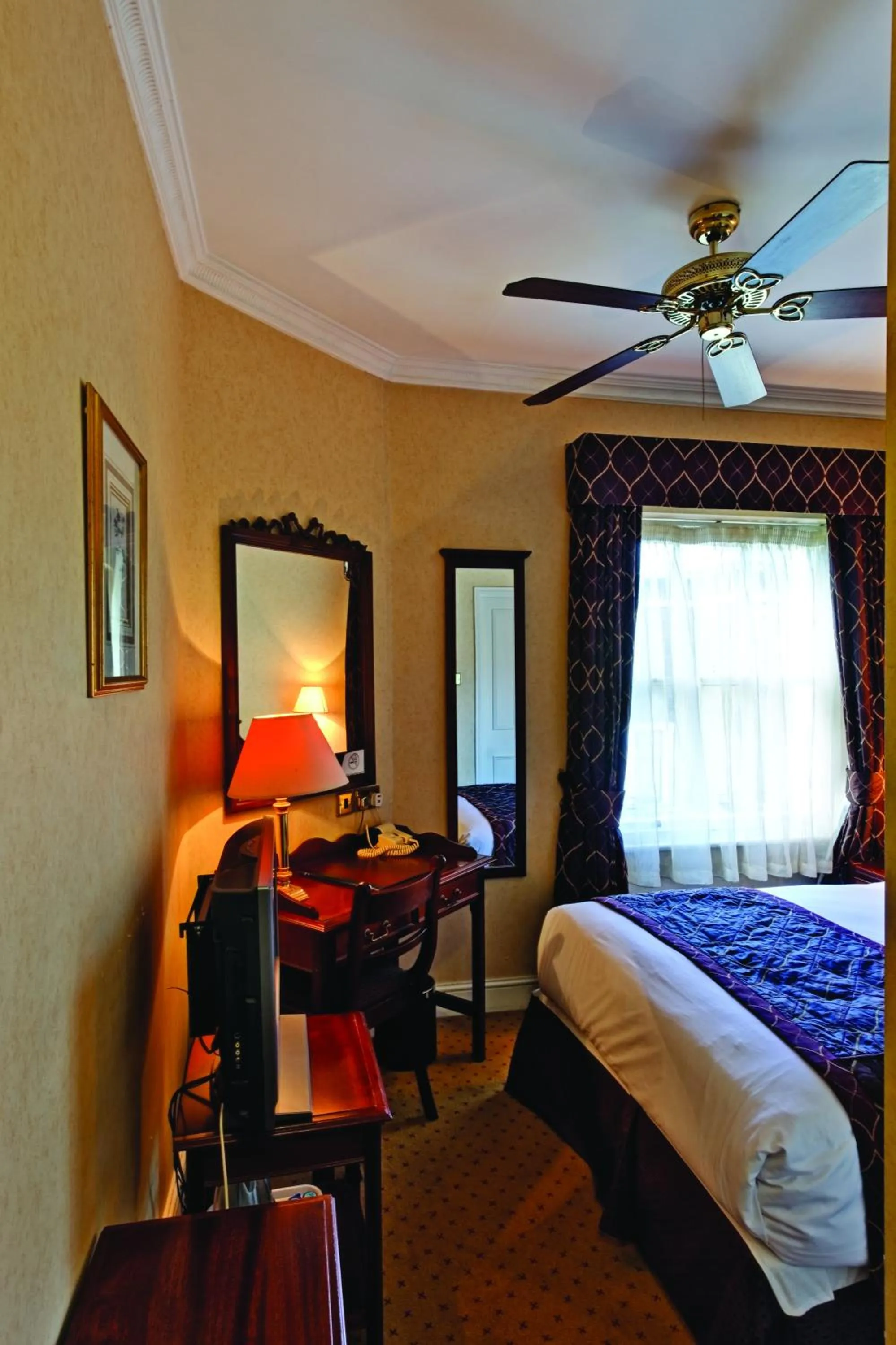 Bedroom in Grange Blooms Hotel