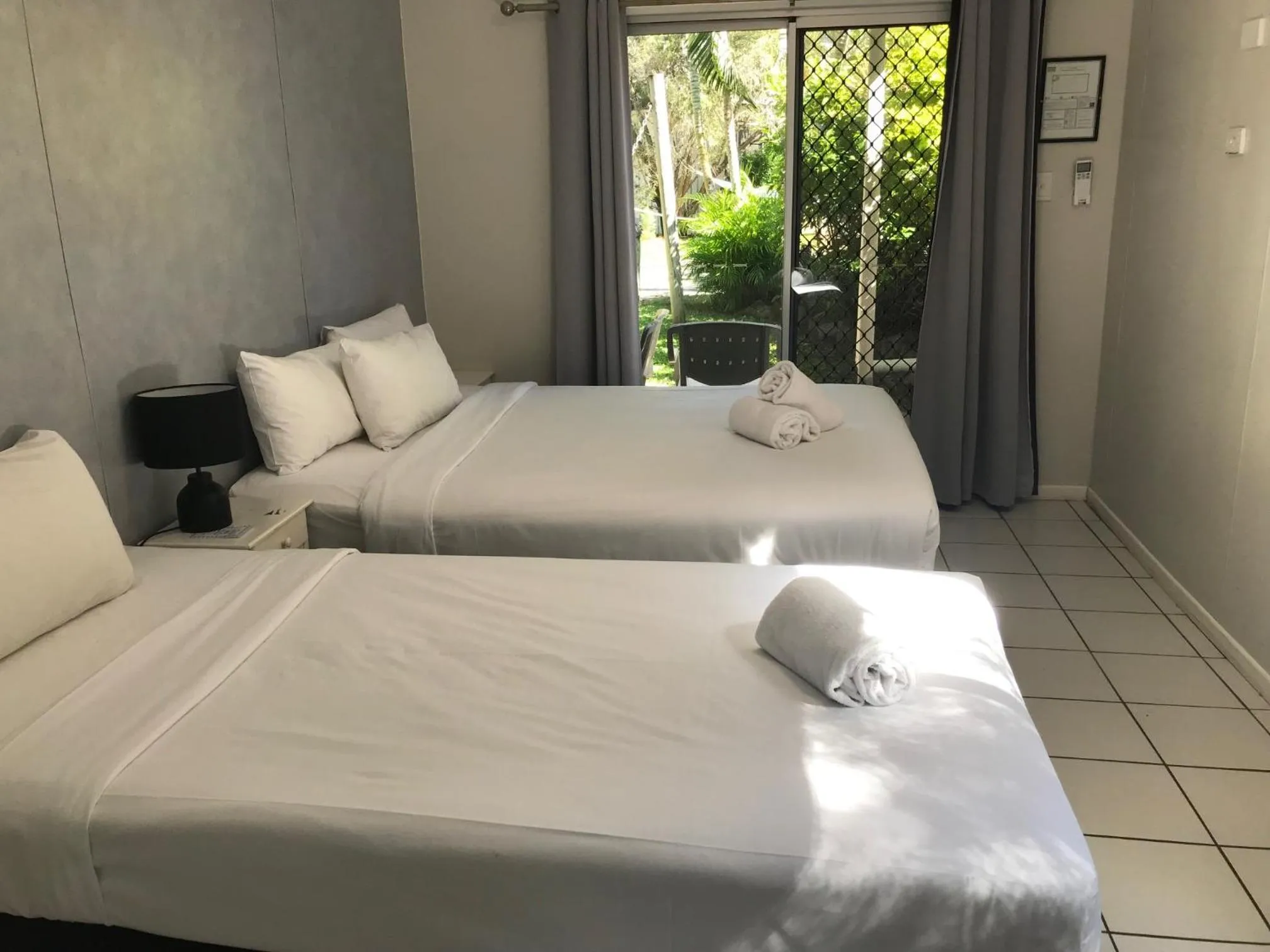 Bed in Bush Village Holiday Cabins