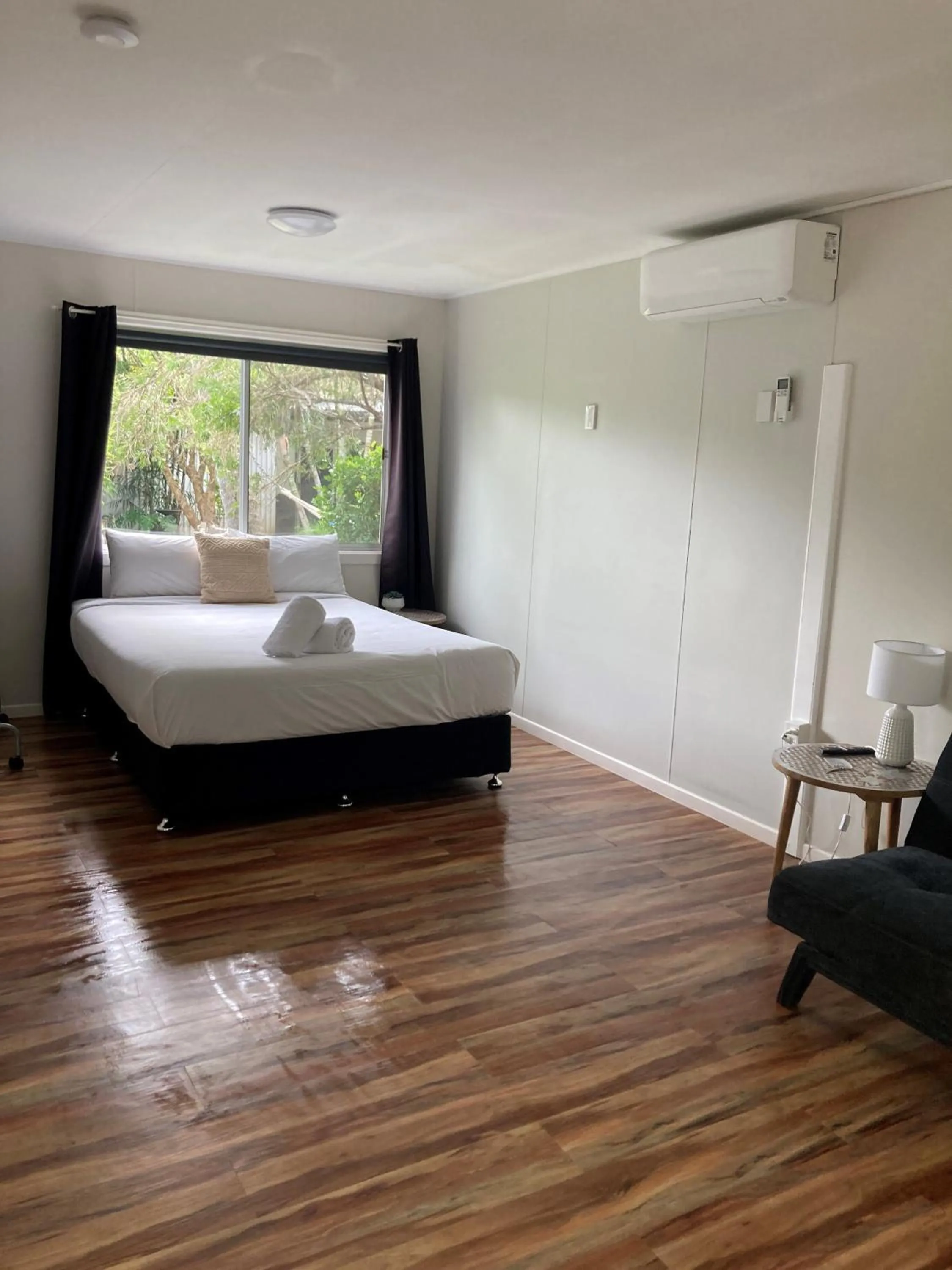 Bed in Bush Village Holiday Cabins