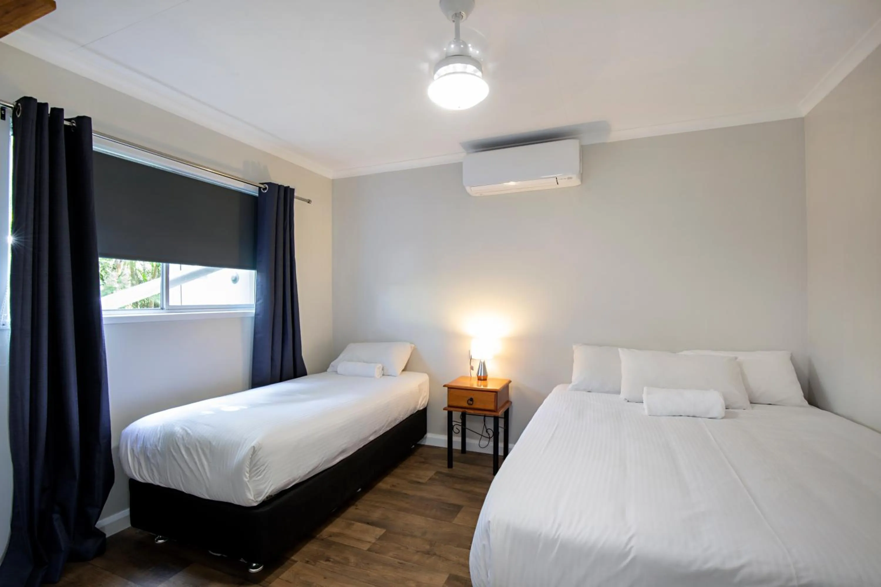 Bed in Bush Village Holiday Cabins