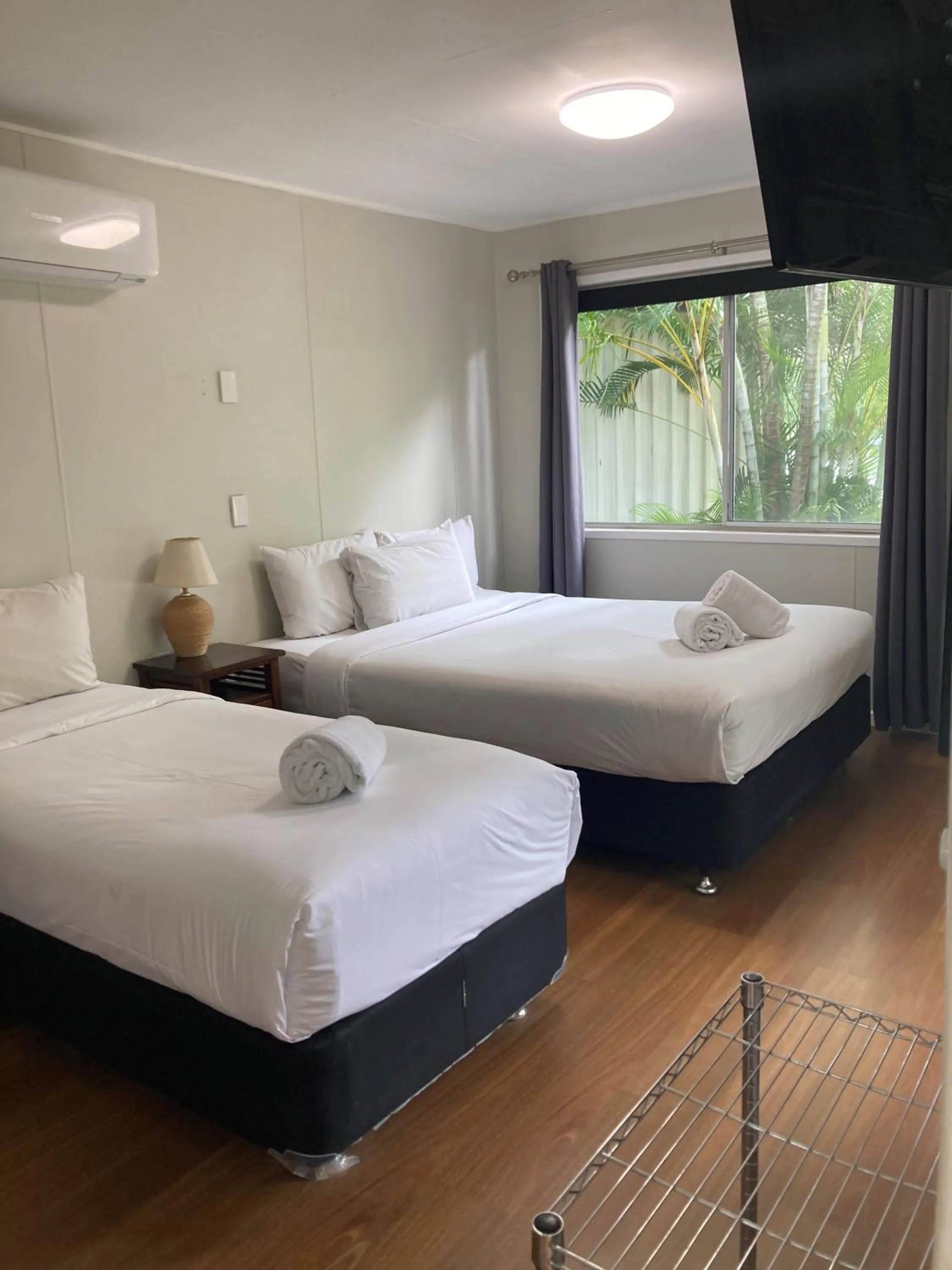 Photo of the whole room, Bed in Bush Village Holiday Cabins