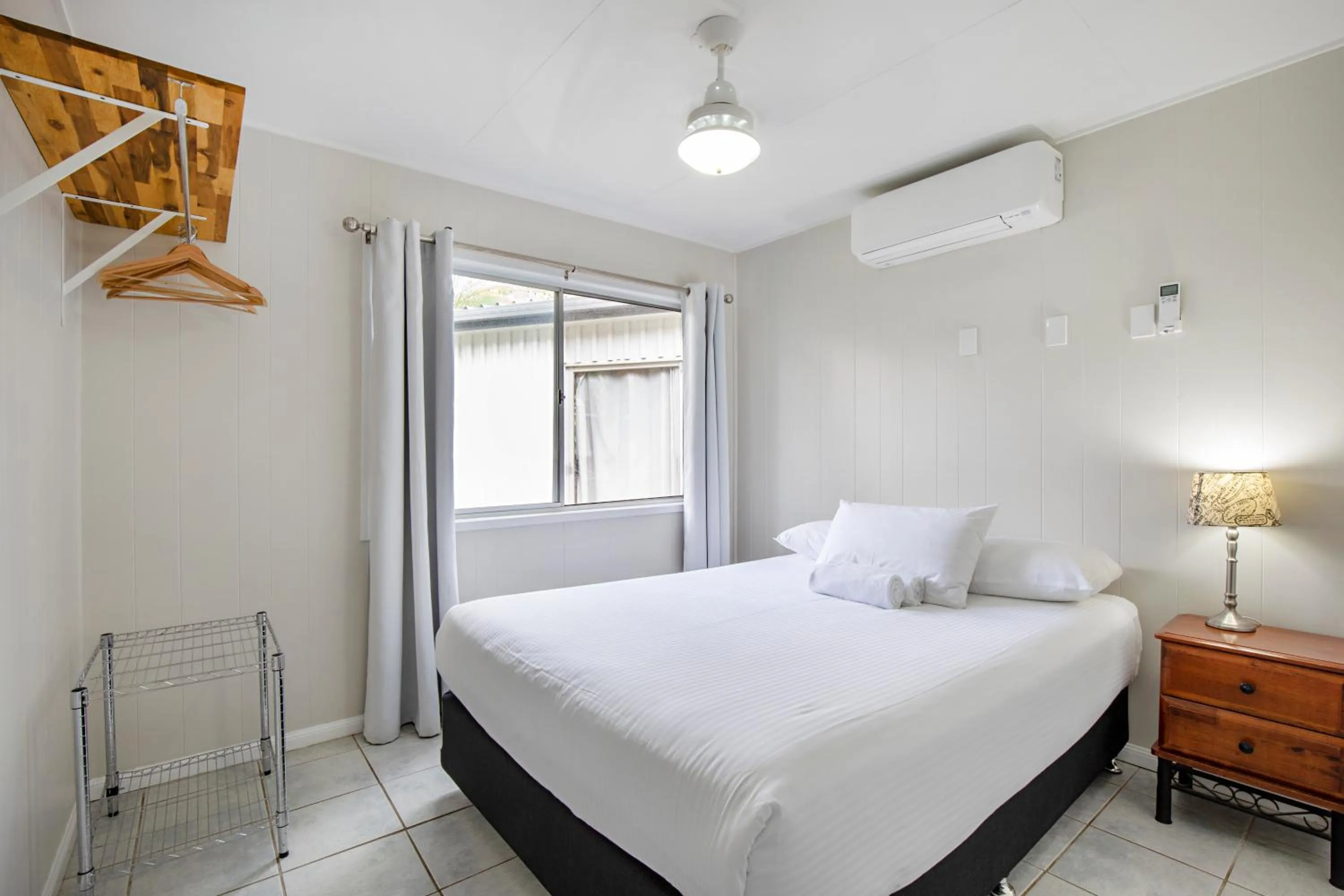 Bed in Bush Village Holiday Cabins