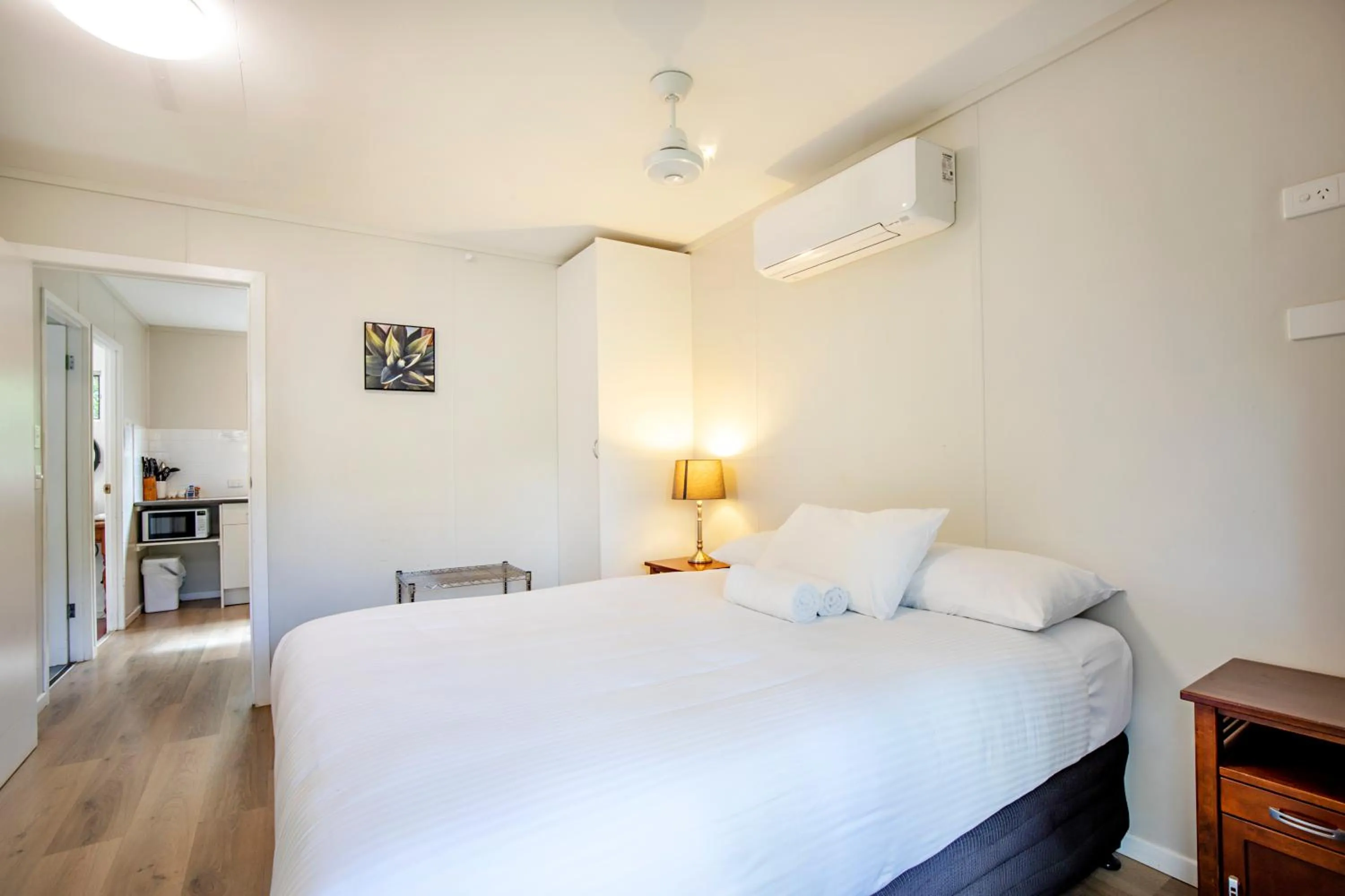 Bed in Bush Village Holiday Cabins