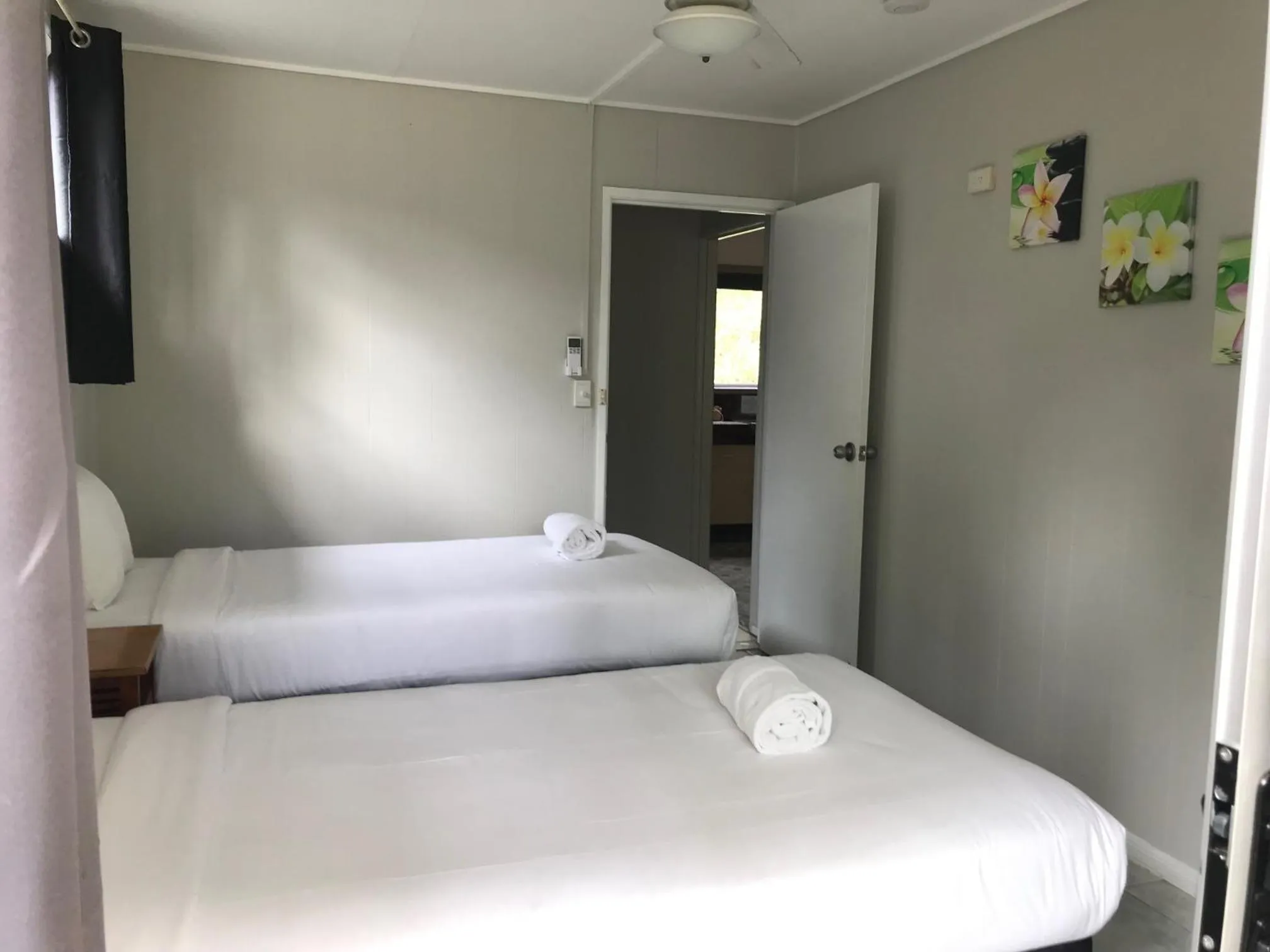 Bed in Bush Village Holiday Cabins