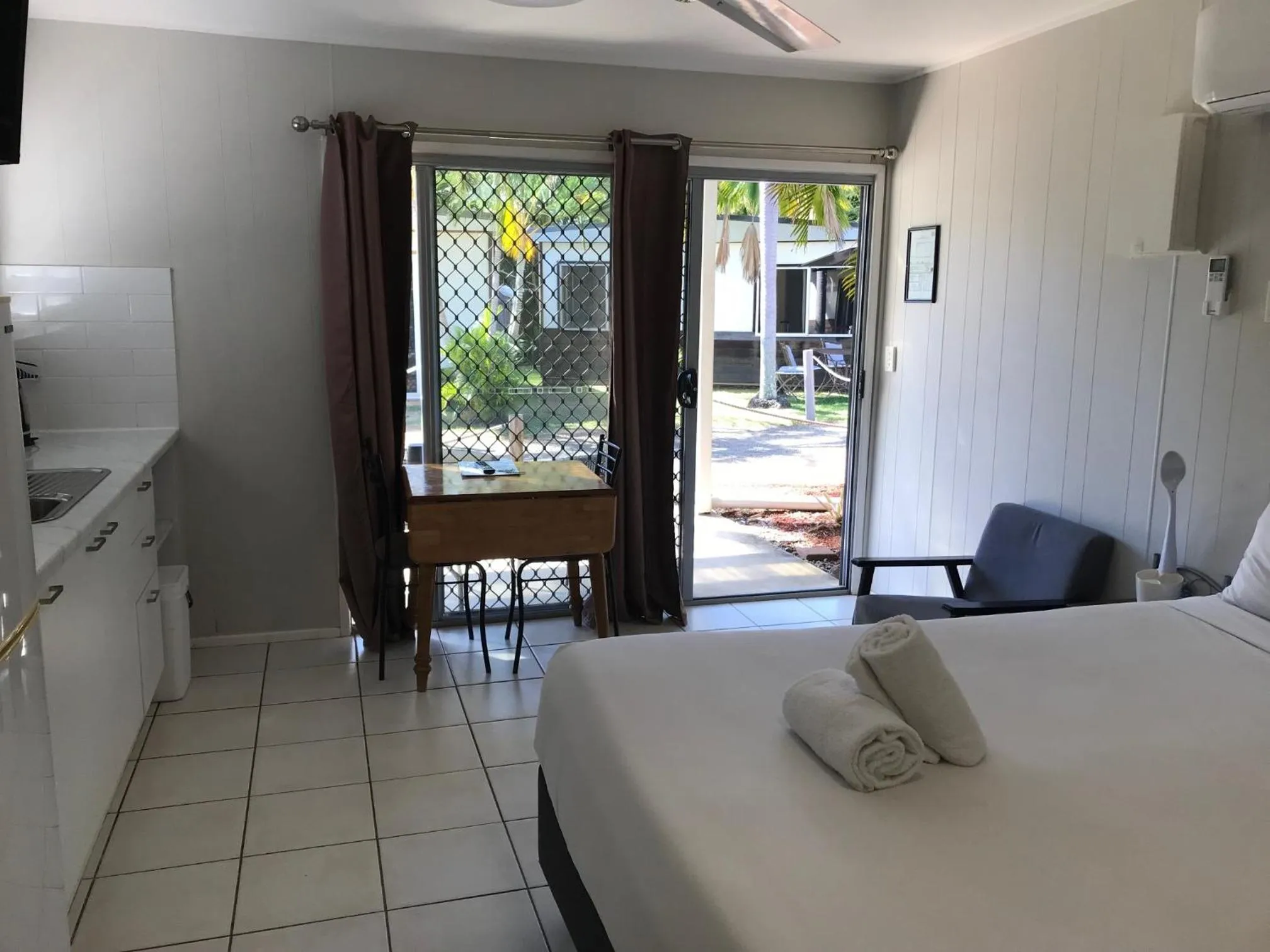 Photo of the whole room, Bed in Bush Village Holiday Cabins