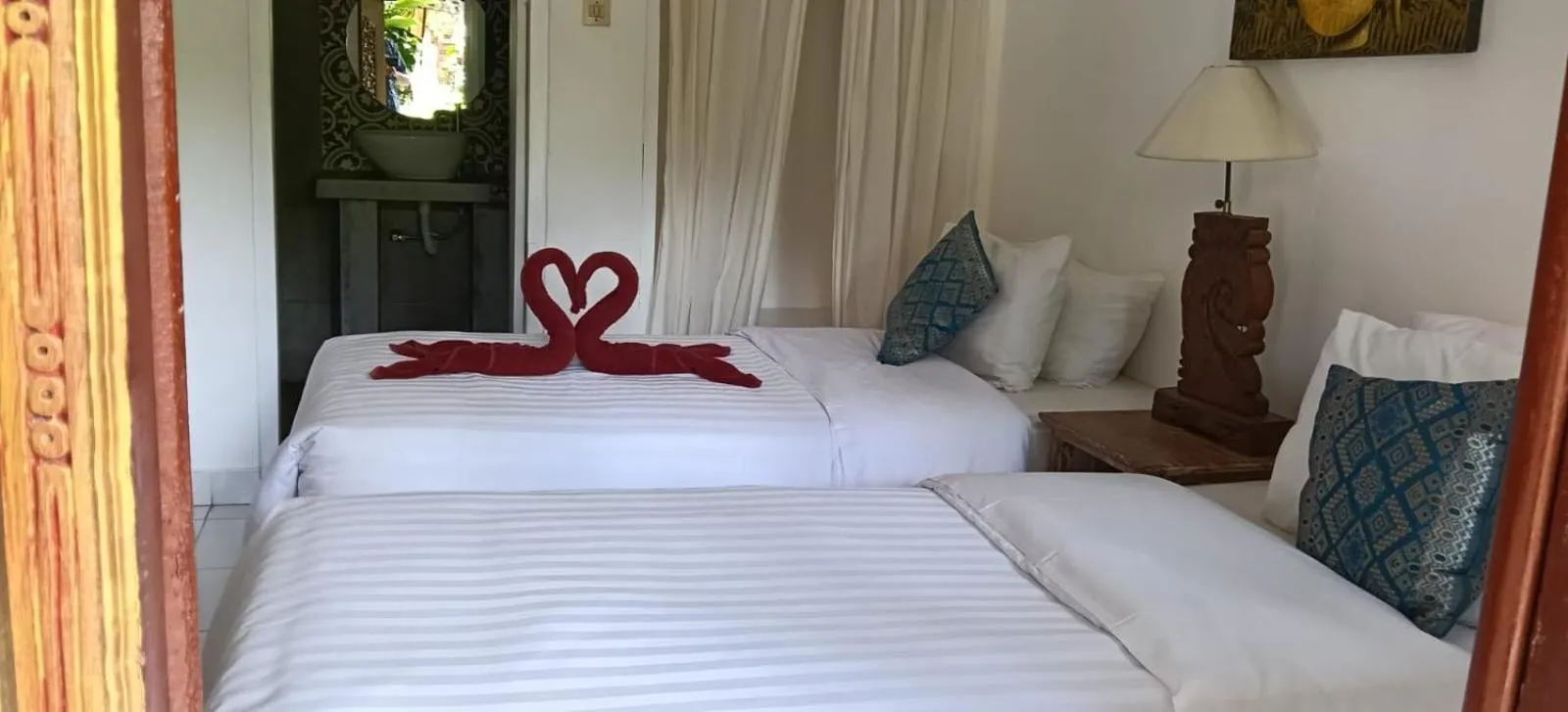 Bed in Puri Oka Beach Bungalows