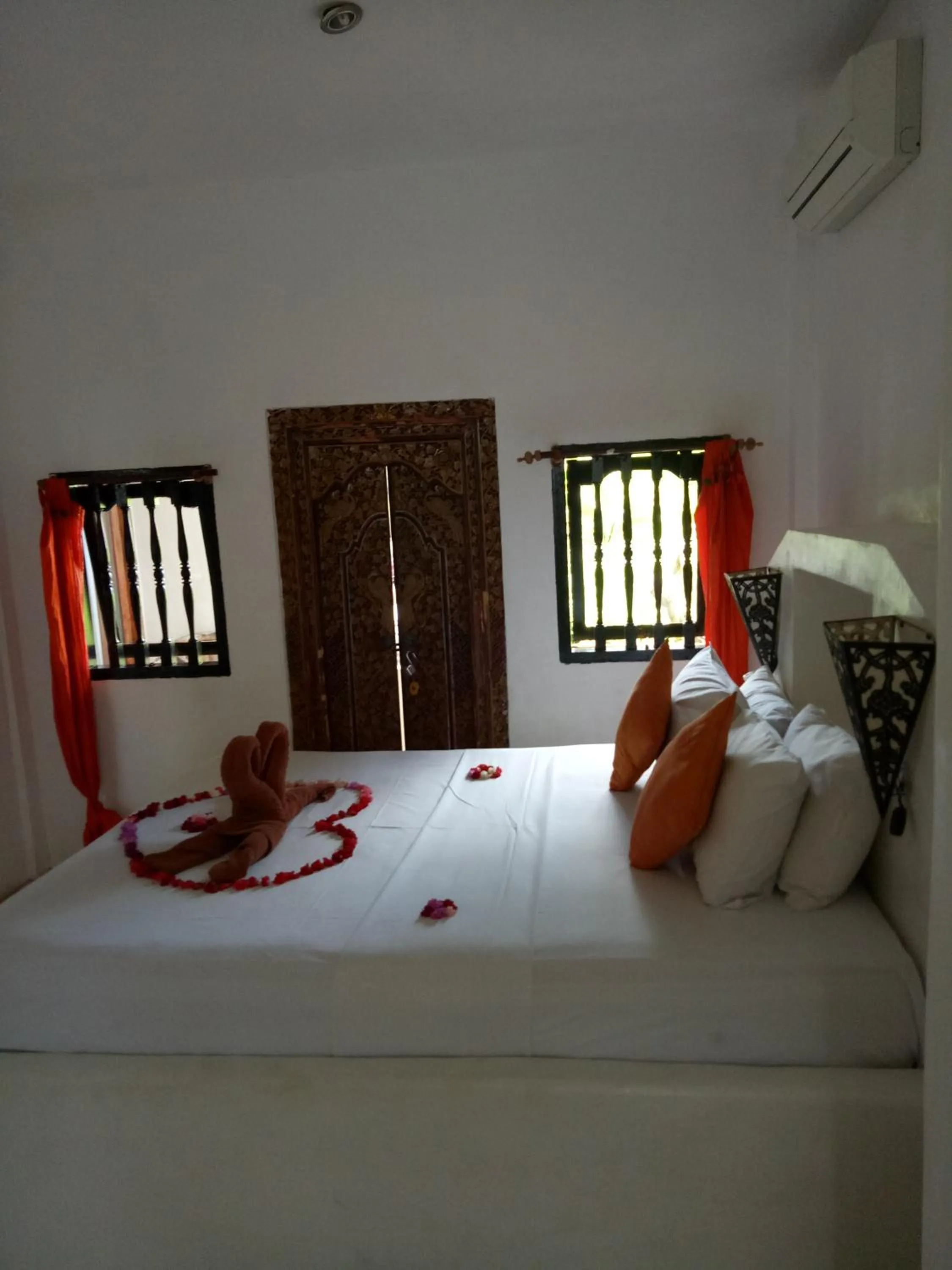 Bed in Puri Oka Beach Bungalows