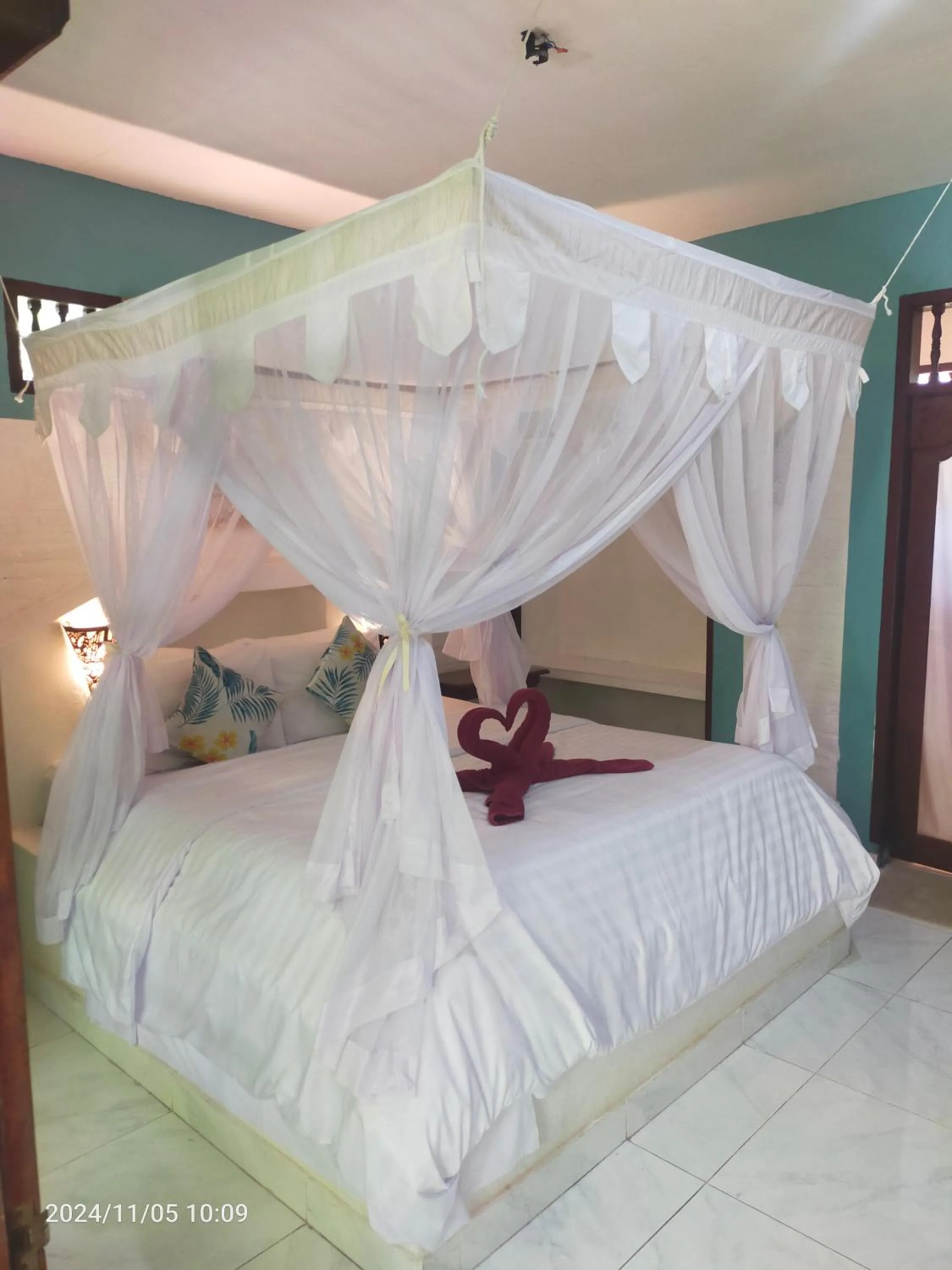 Bed in Puri Oka Beach Bungalows