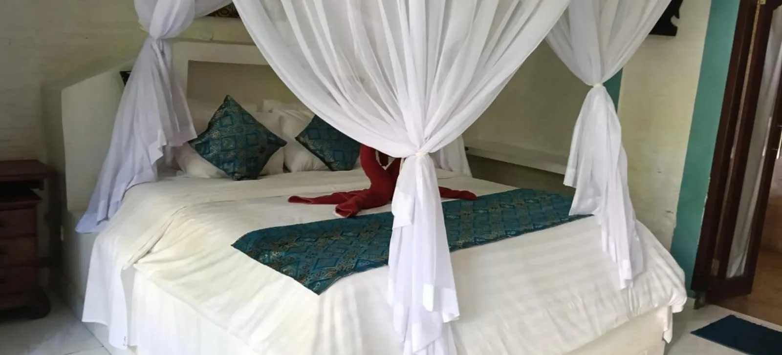 Bed in Puri Oka Beach Bungalows