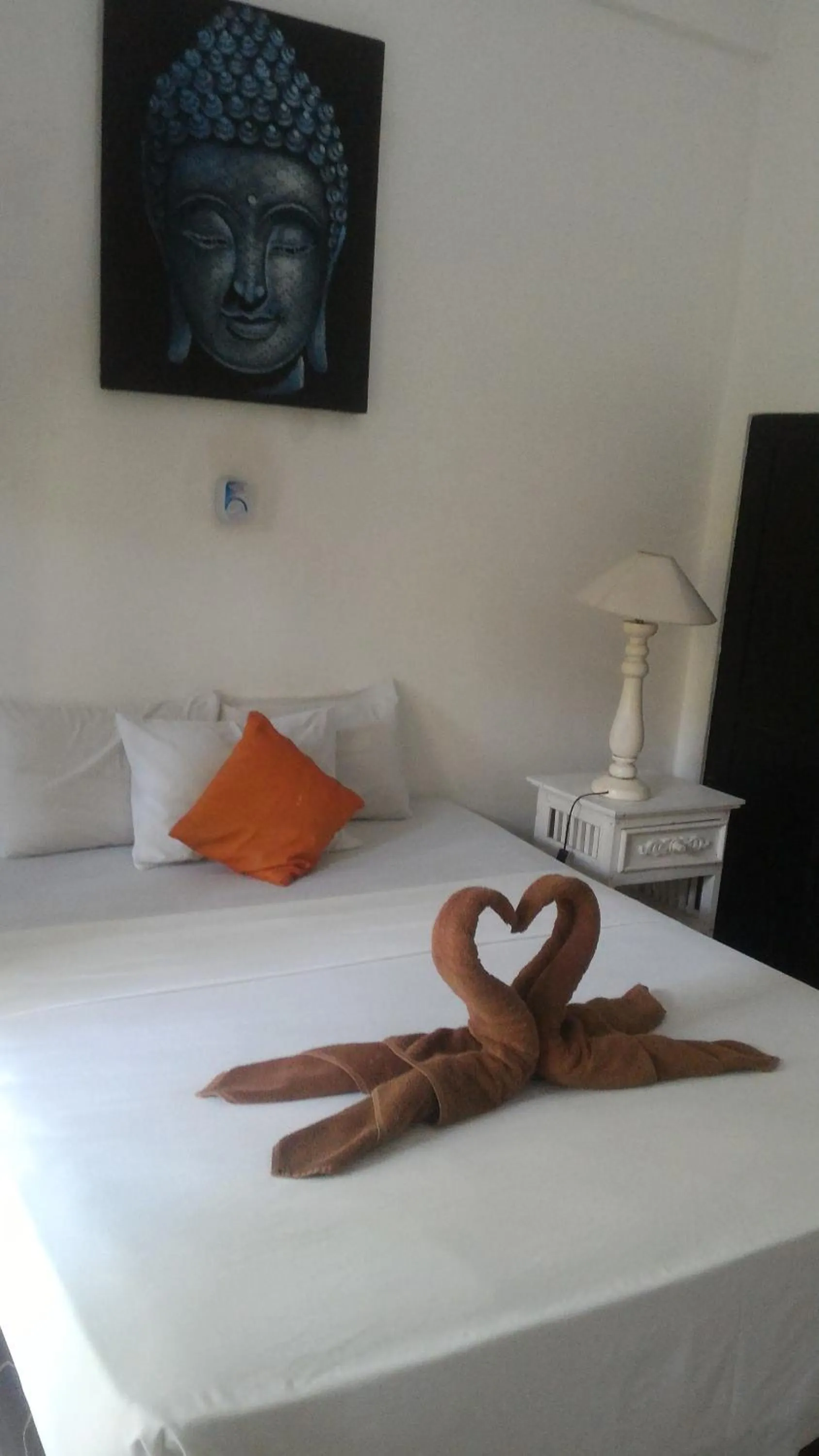 Bed in Puri Oka Beach Bungalows