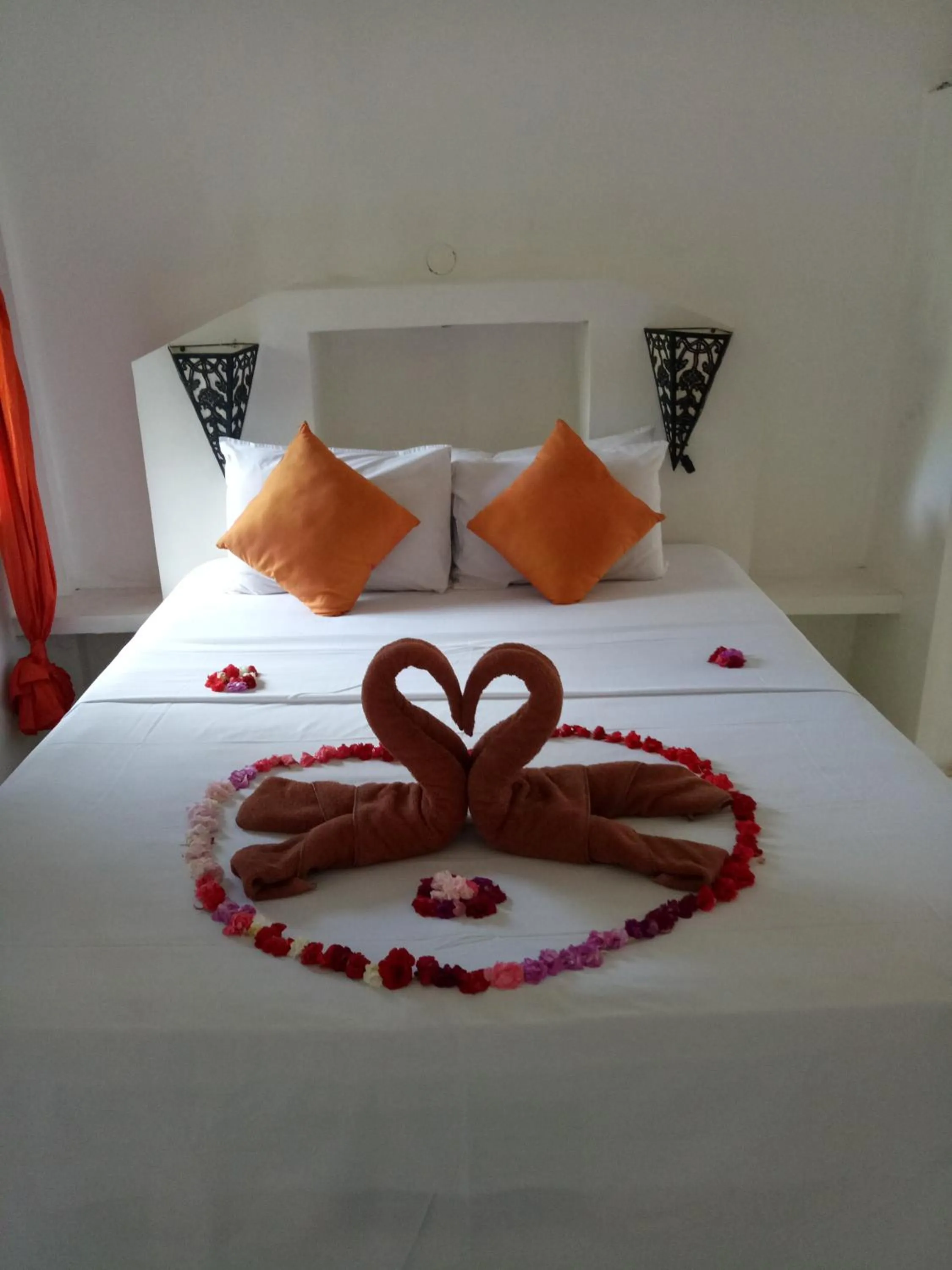 Bed in Puri Oka Beach Bungalows