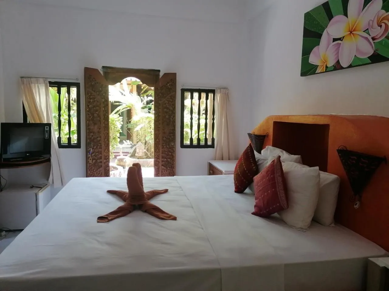 Bed in Puri Oka Beach Bungalows