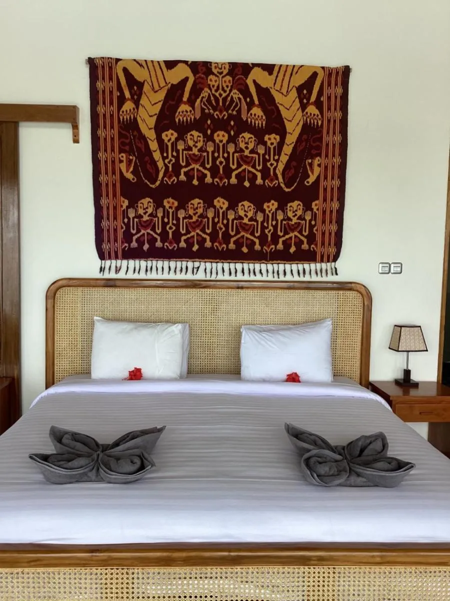 Bed in Puri Oka Beach Bungalows