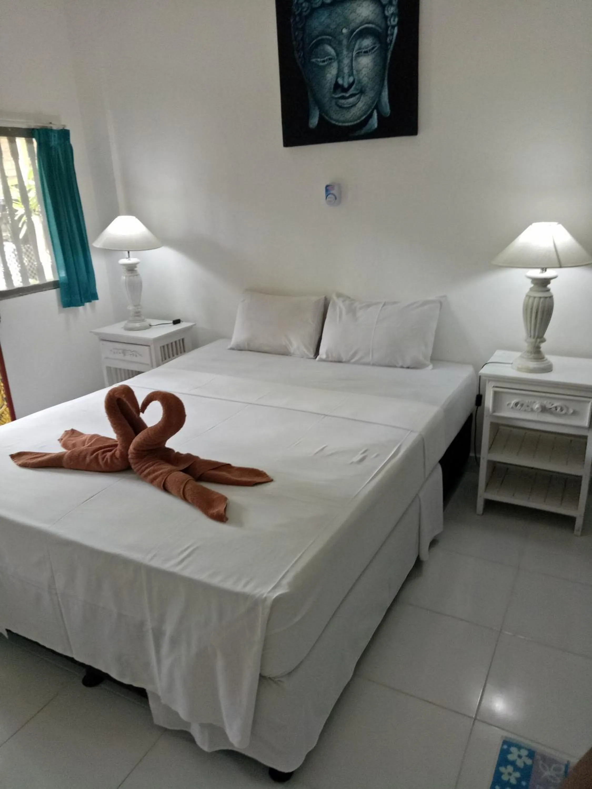 Bed in Puri Oka Beach Bungalows