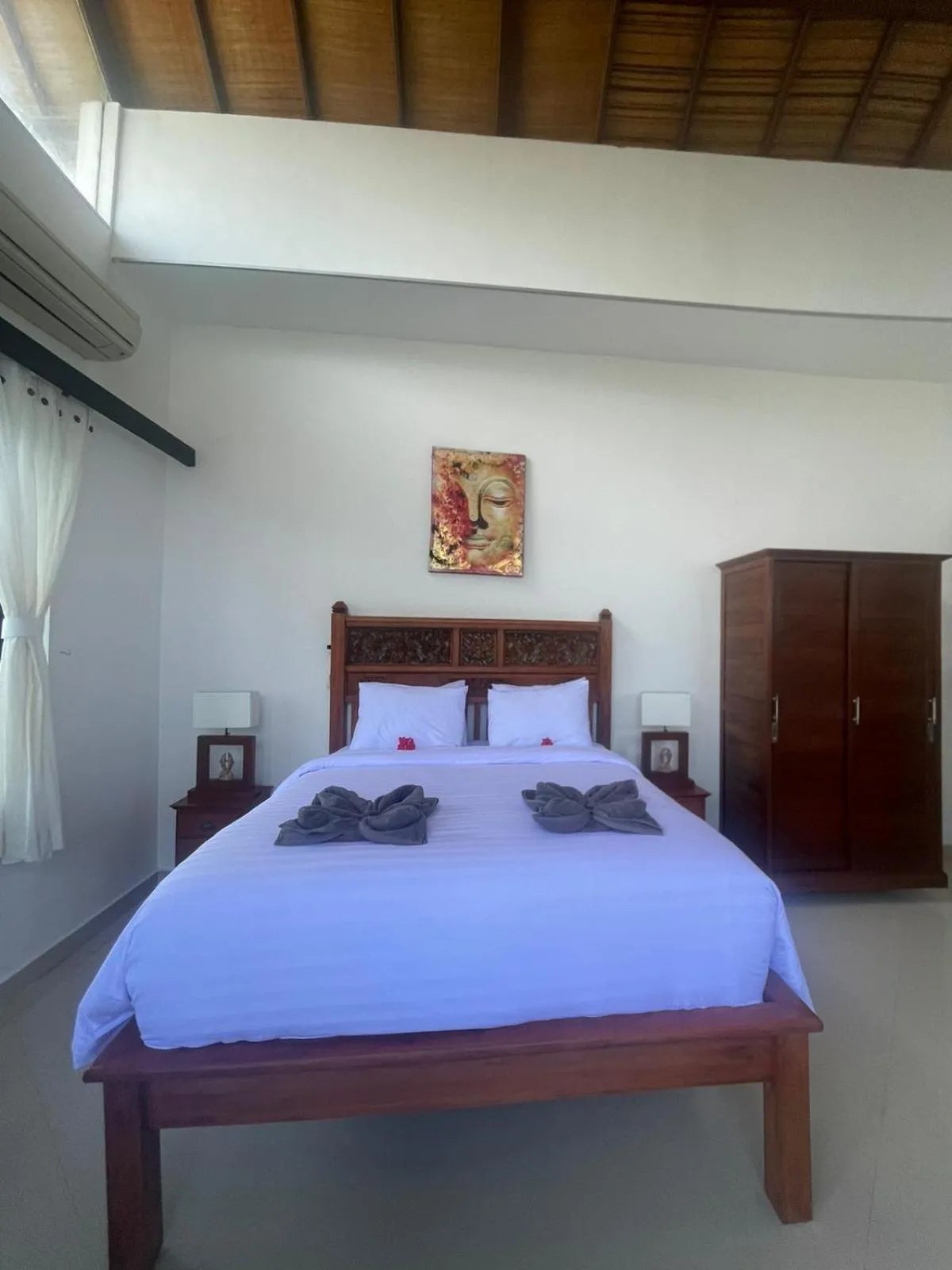 Bed in Puri Oka Beach Bungalows