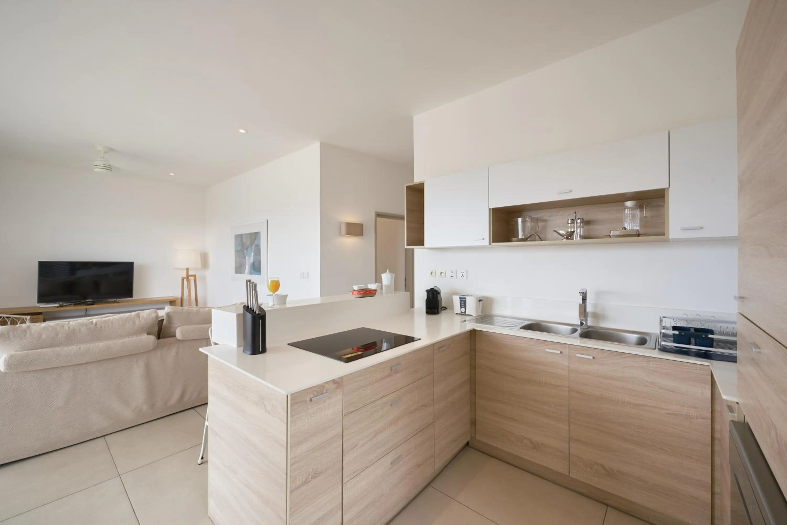 Kitchen or kitchenette in Les Estivales Beachfront Suites & Penthouses by LOV Mauritius