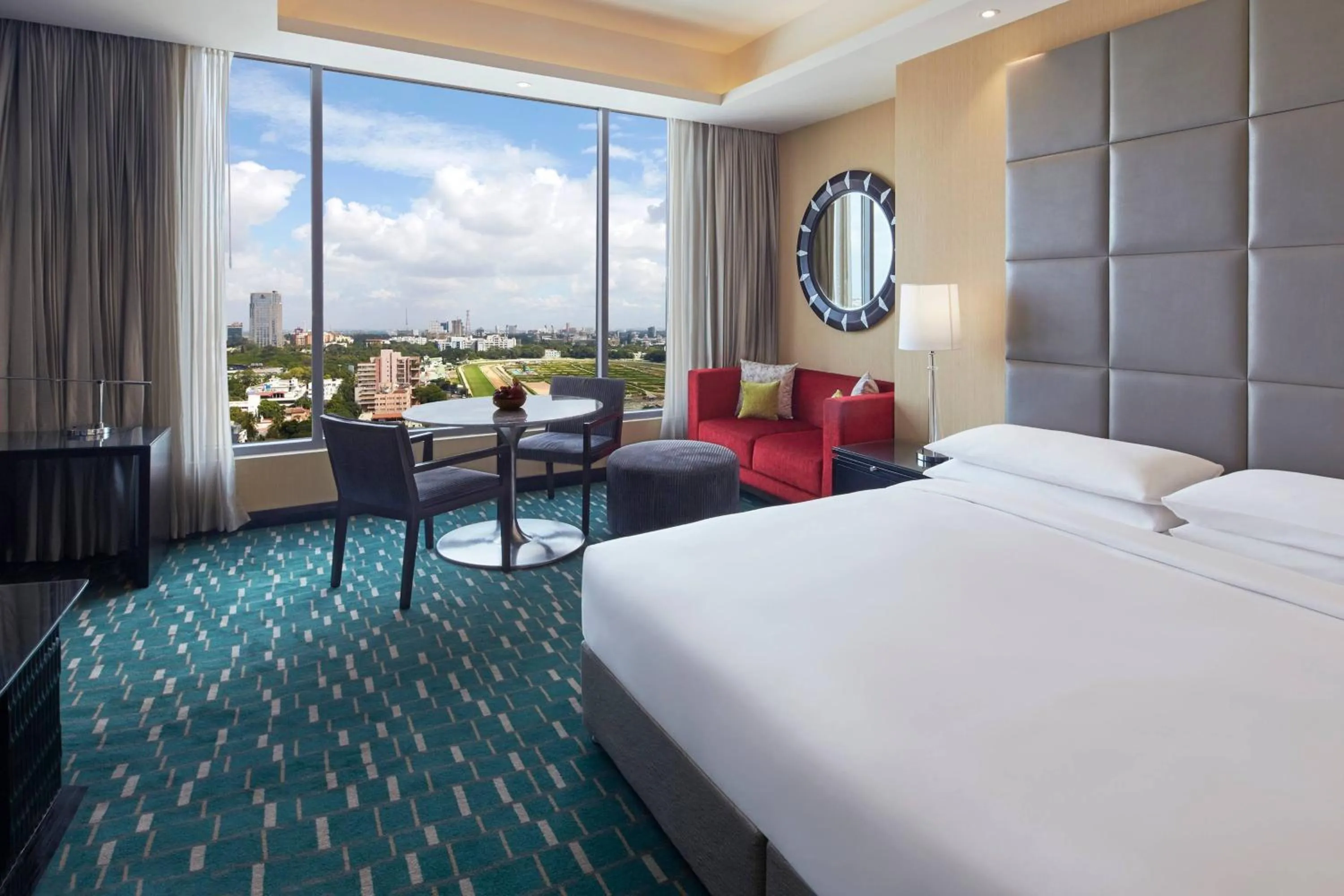 Lounge or bar, Bed in Renaissance Bengaluru Race Course Hotel