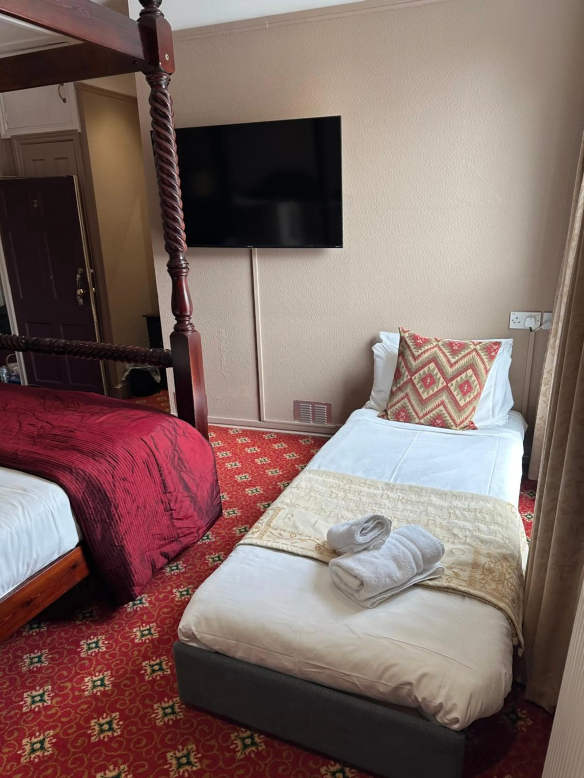 Bed in The Tudor Hotel