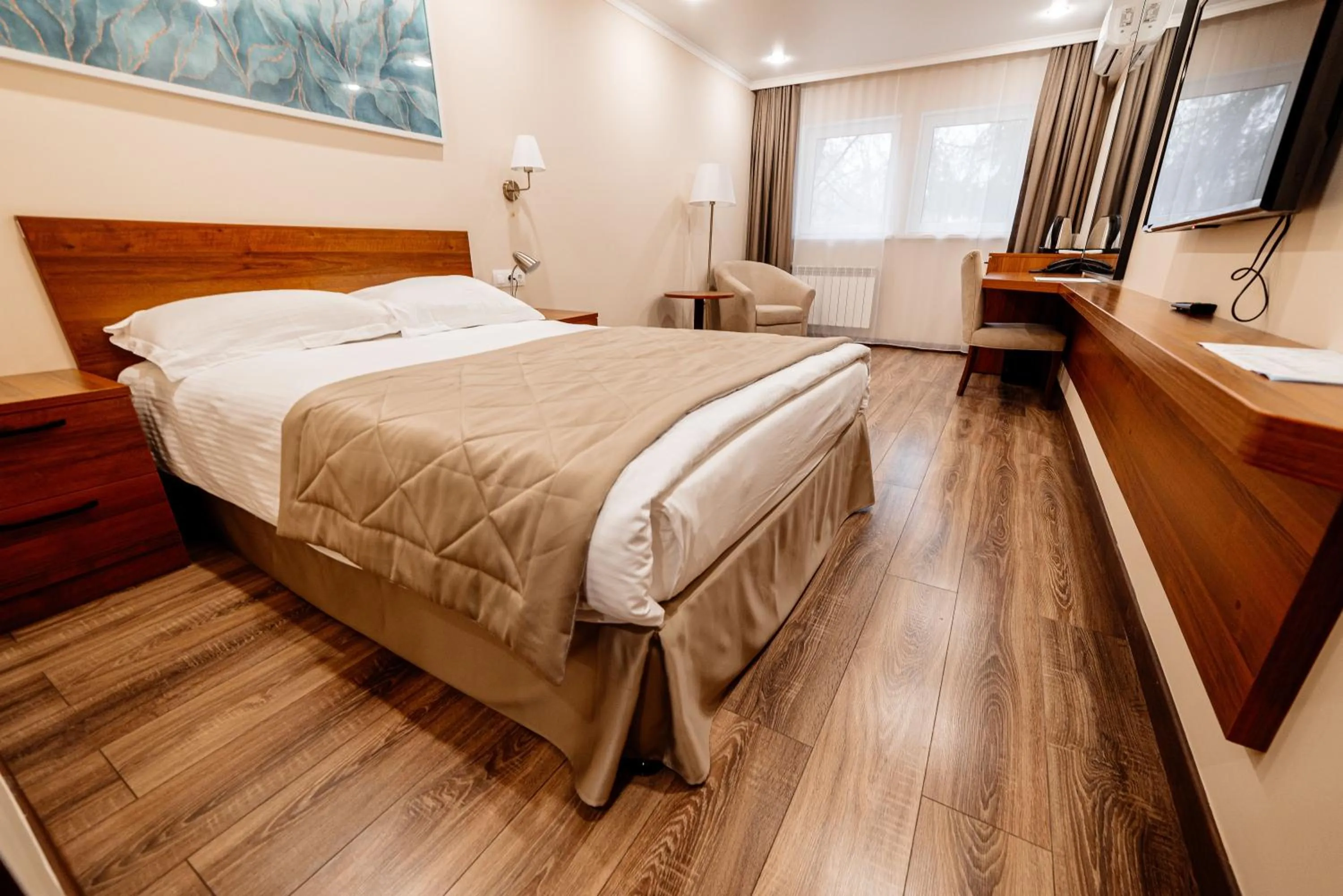 Communal lounge/ TV room, Bed in Chagala Hotel Uralsk