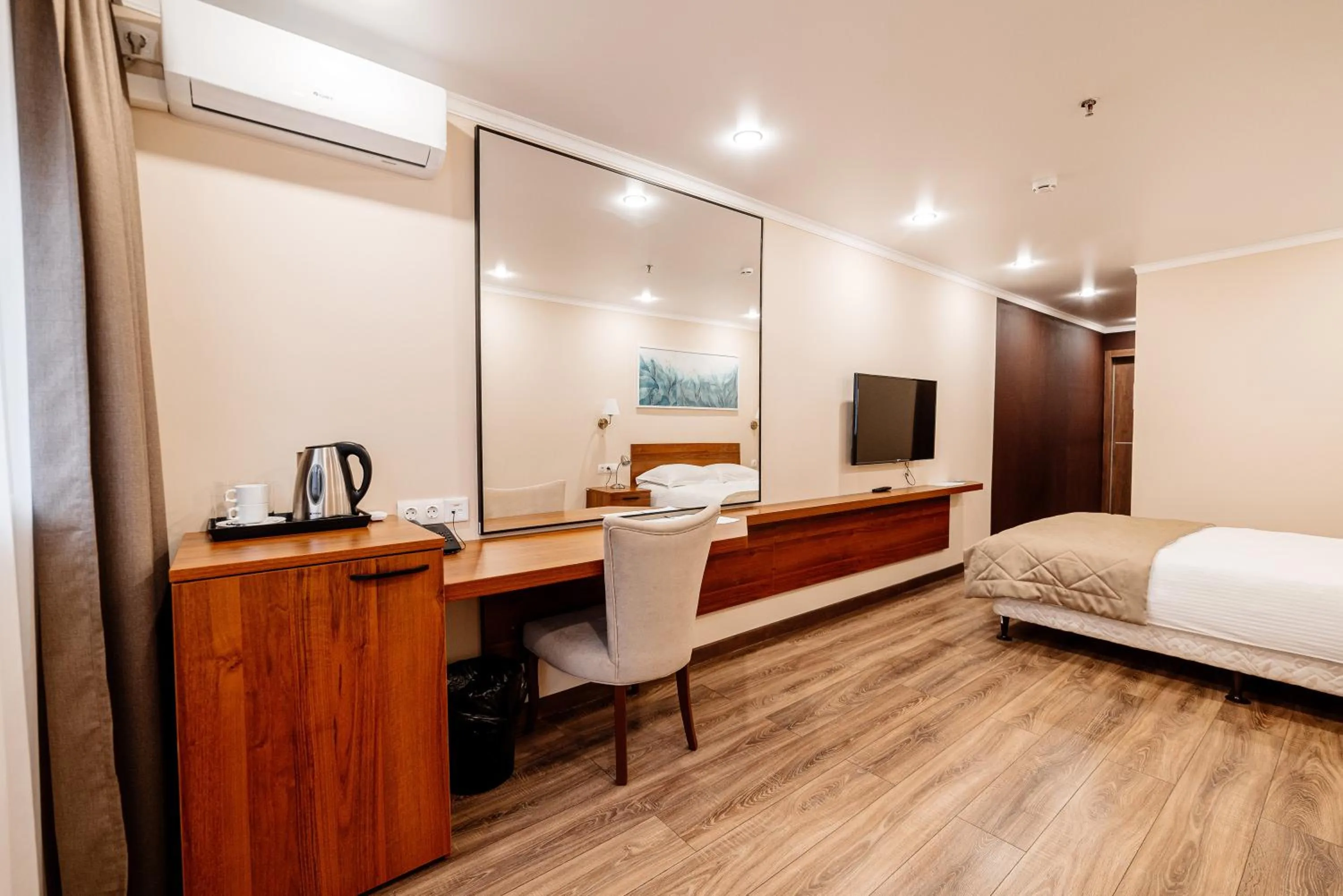 TV and multimedia, Bed in Chagala Hotel Uralsk