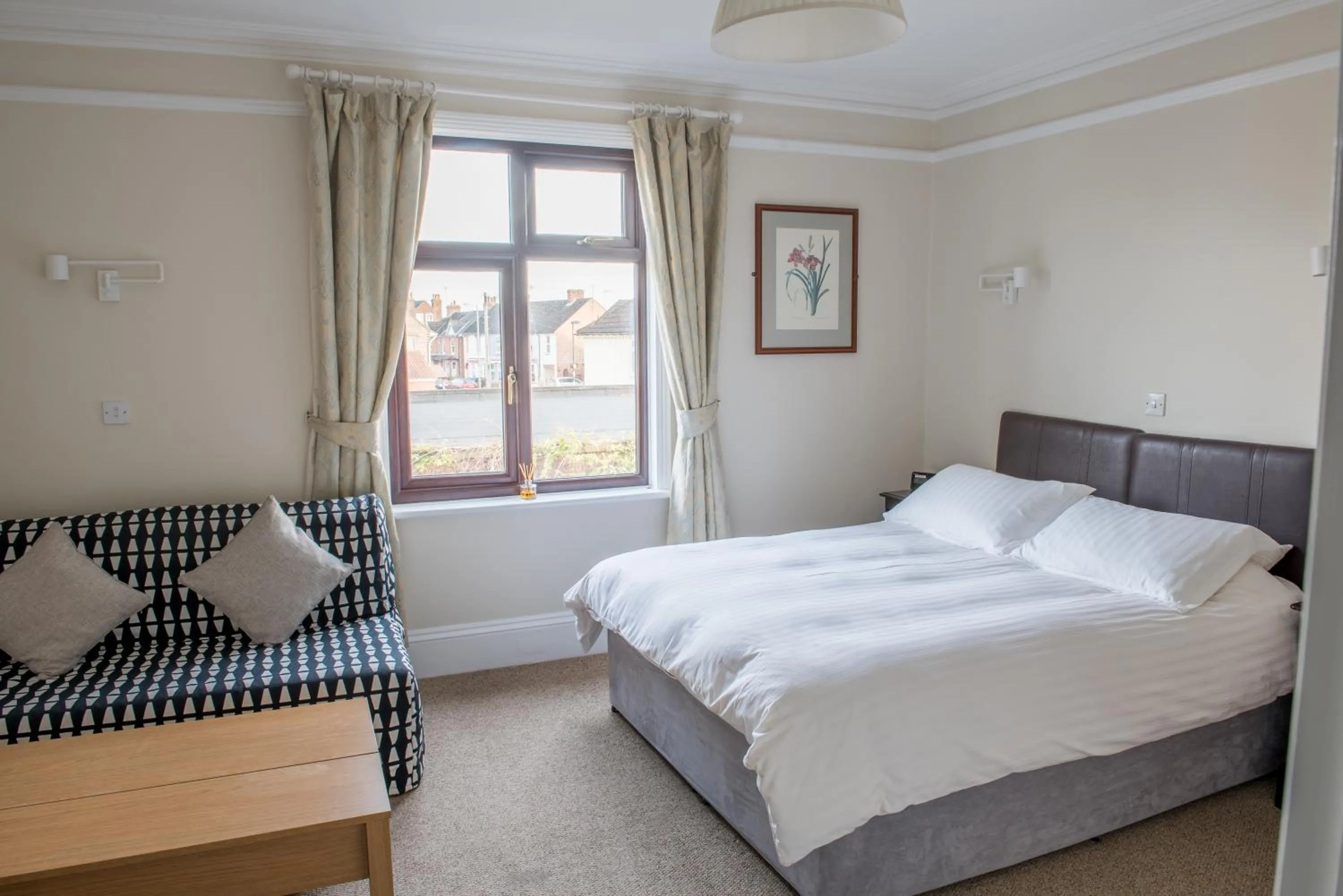 Bed in Toothbrush Rooms at Lattice Lodge - Guest Kitchen & EV Recharging