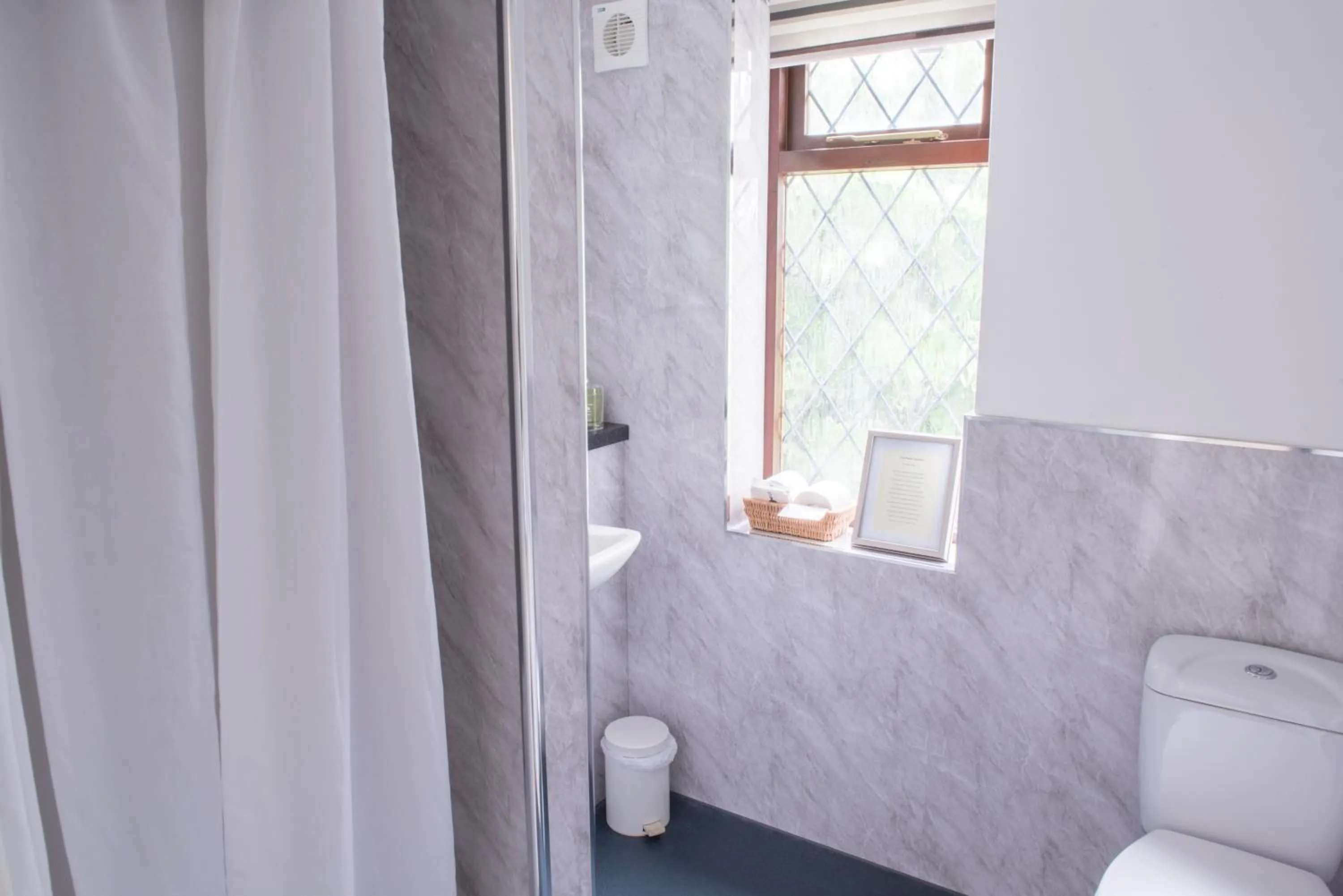 Shower in Toothbrush Rooms at Lattice Lodge - Guest Kitchen & EV Recharging