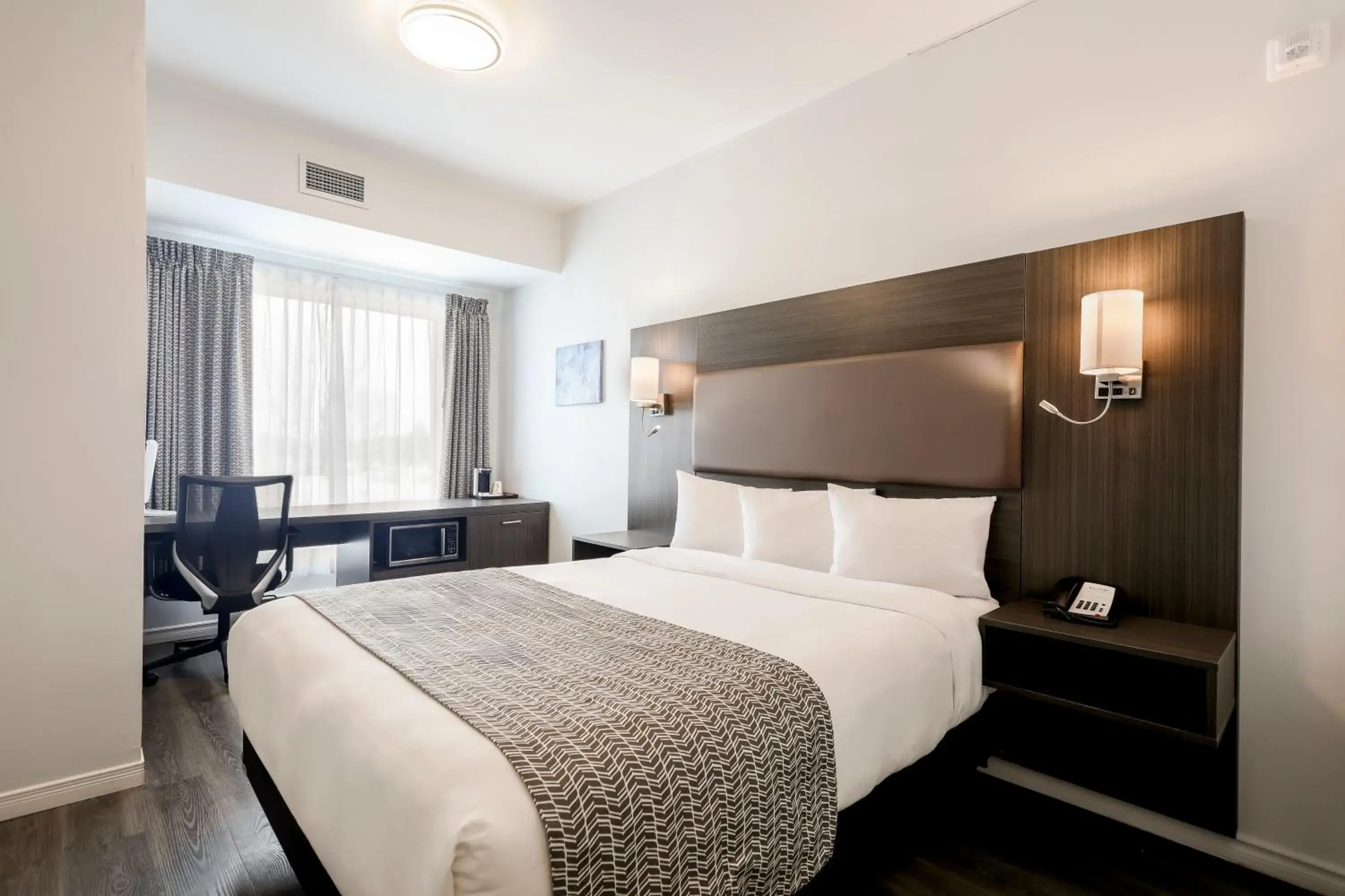 Bed in Travelodge by Wyndham Rigaud Bed in Travelodge by Wyndham Rigaud