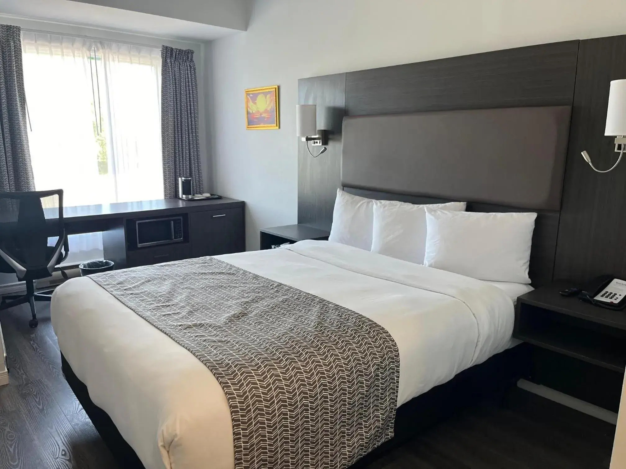 Bed in Travelodge by Wyndham Rigaud Bed in Travelodge by Wyndham Rigaud