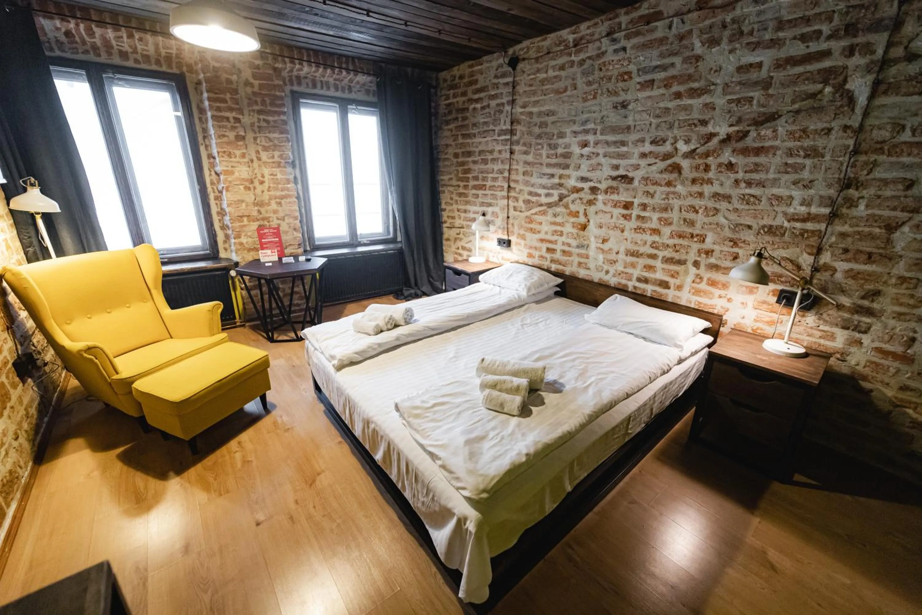 Bed in Apartments JustLvivIt at the Rynok Square