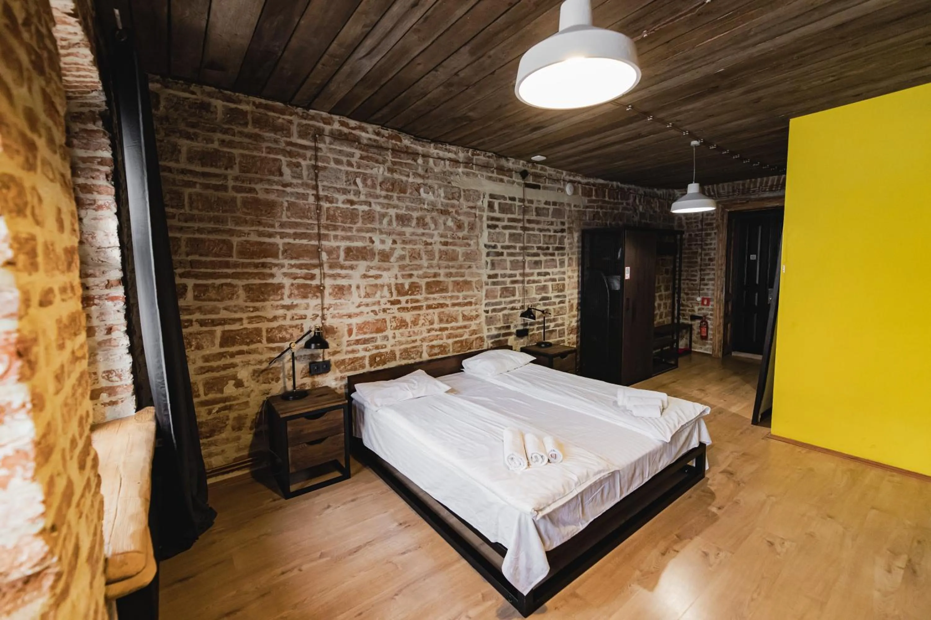 Bed in Apartments JustLvivIt at the Rynok Square