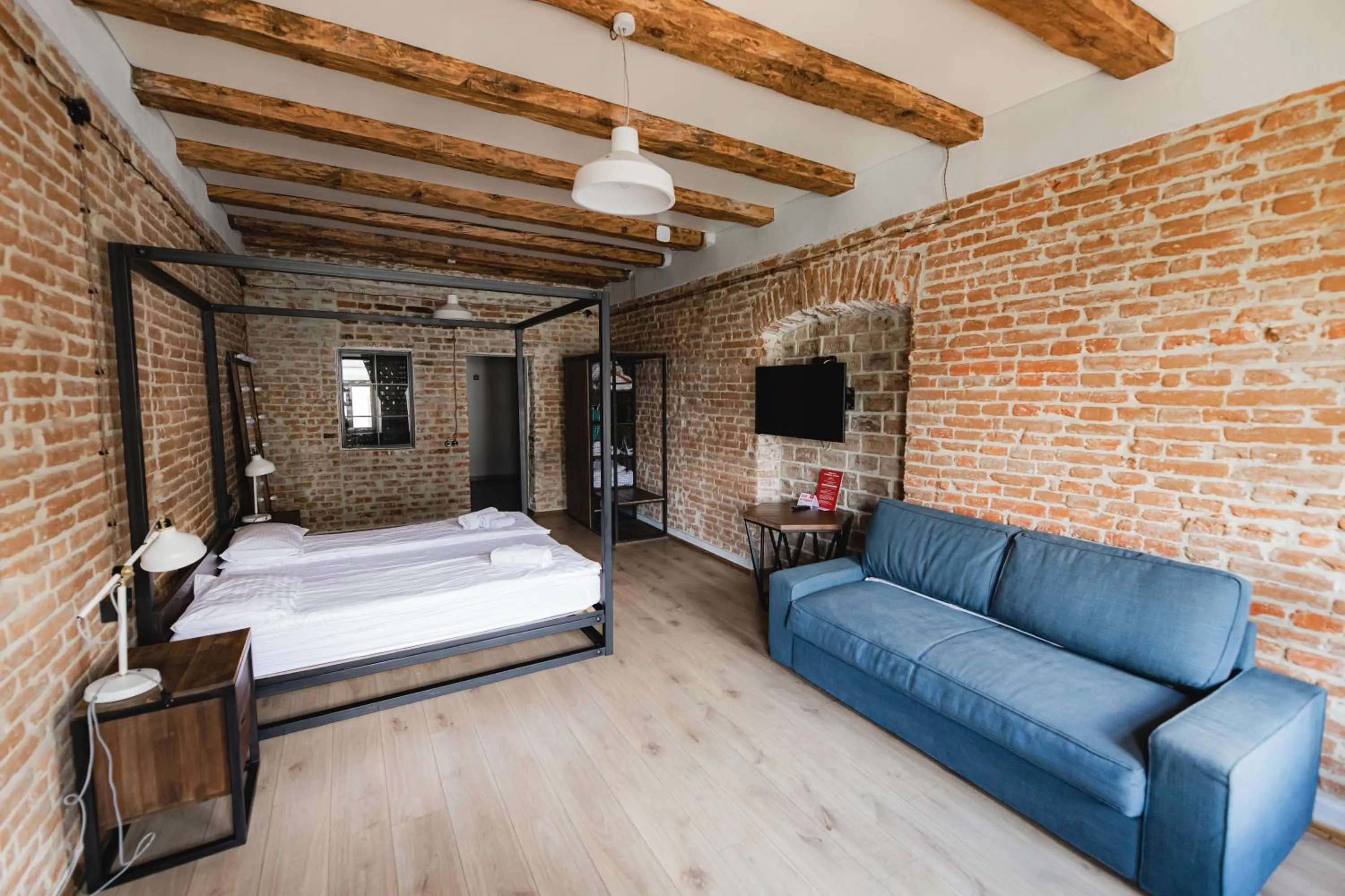 Bed in Apartments JustLvivIt at the Rynok Square