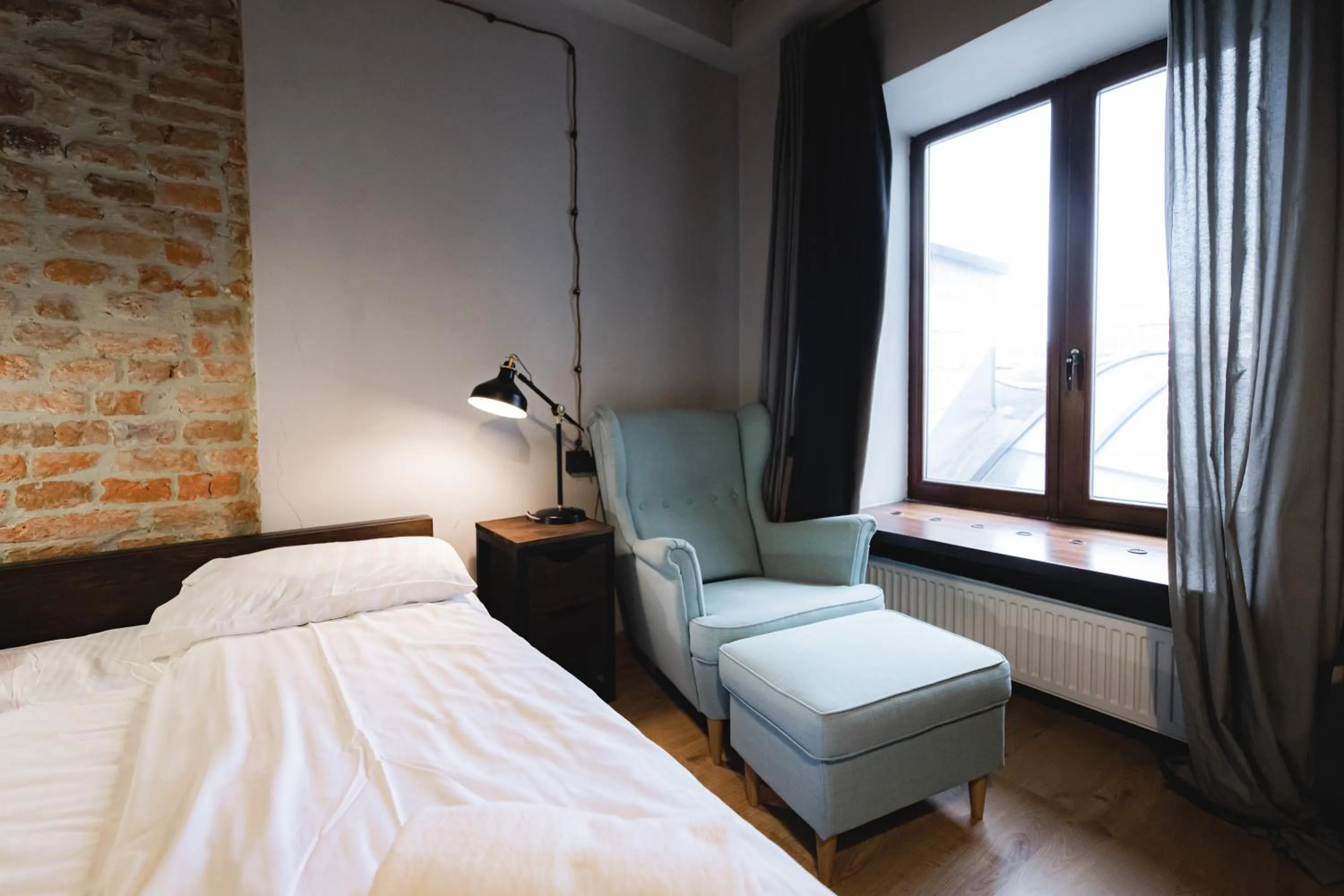 Bed in Apartments JustLvivIt at the Rynok Square